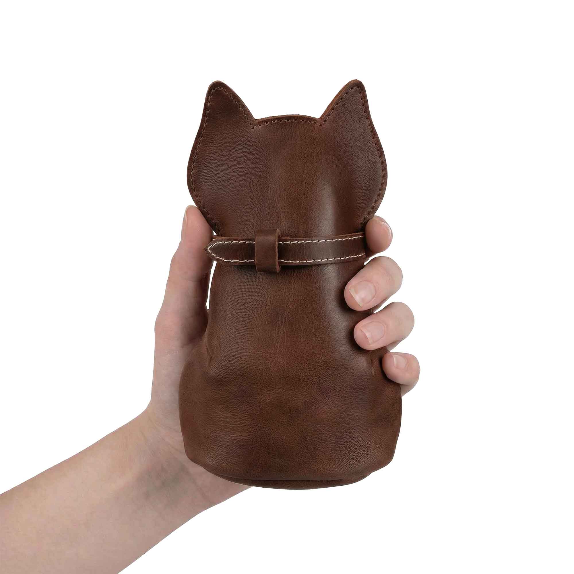 Showcasing the Hide & Play Kitty Pouch, a Cat-Shaped Money Organizer made of Full Grain Leather. This stylish Small Coin Pouch is hand cut and hand sewn by artisans in La Antigua Guatemala & Oaxaca Mexico. Perfect as a Zip Wallet for Coins, it's a practical Change Purse for both men and women.