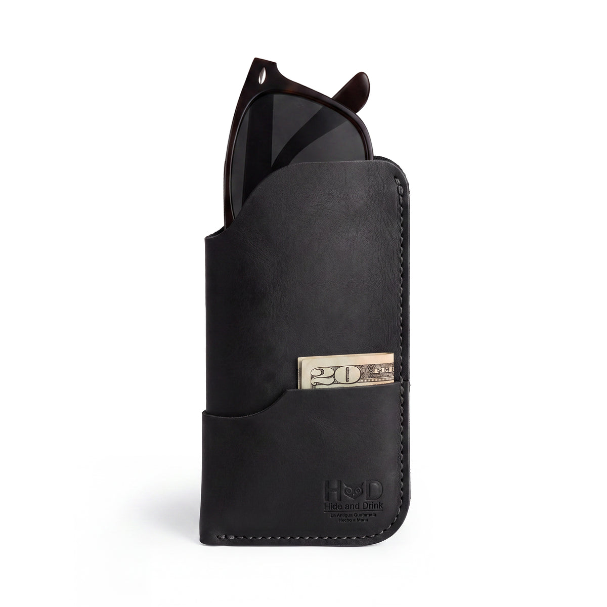 Introductions to the Hide & Drink Sunglass Case & Wallet in black leather, showcasing its premium quality. This Rustic Sunglasses Case & Wallet is an excellent eyeglasses sleeve for travel, featuring hand-made artisan craftsmanship from La Antigua Guatemala & Oaxaca Mexico.