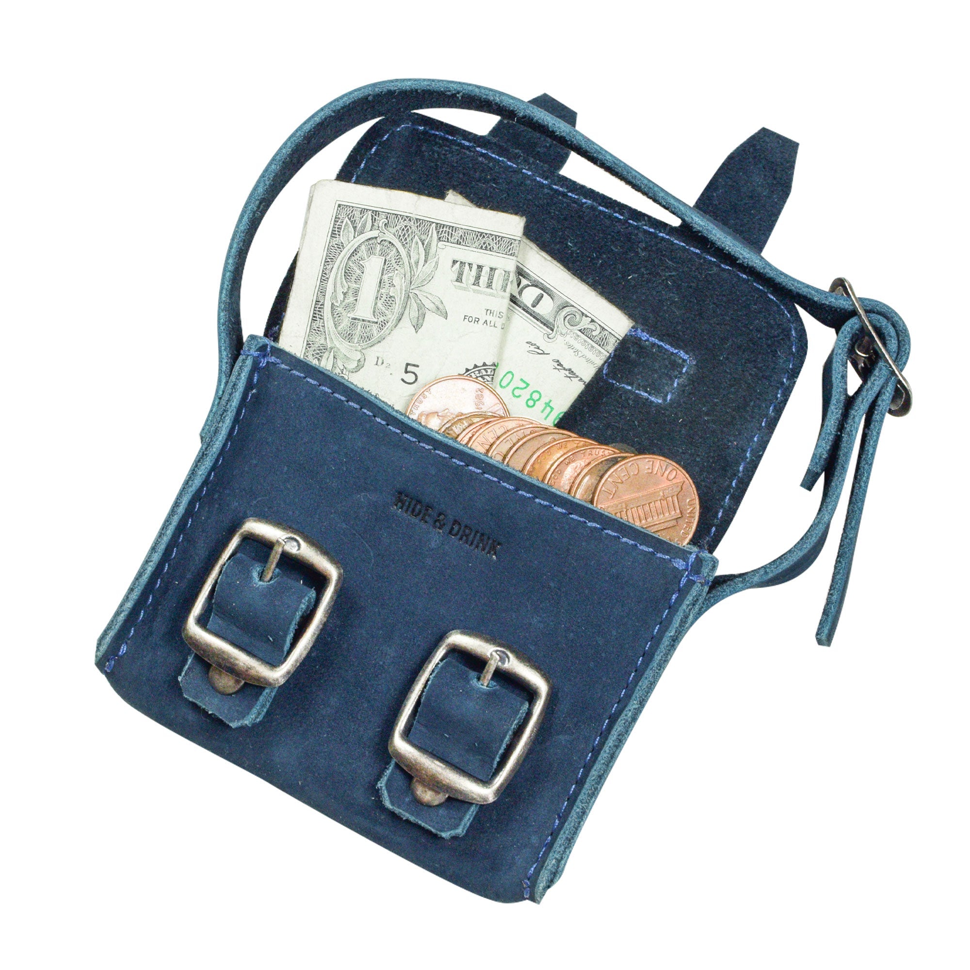 Inside view of the navy Tiny Messenger Bag by Hide & Drink, highlighting space for cash and coins. This Mini Messenger Bag Charm made from premium Full Grain Leather is a versatile keychain or handbag accessory, reflecting artisan quality from La Antigua Guatemala.
