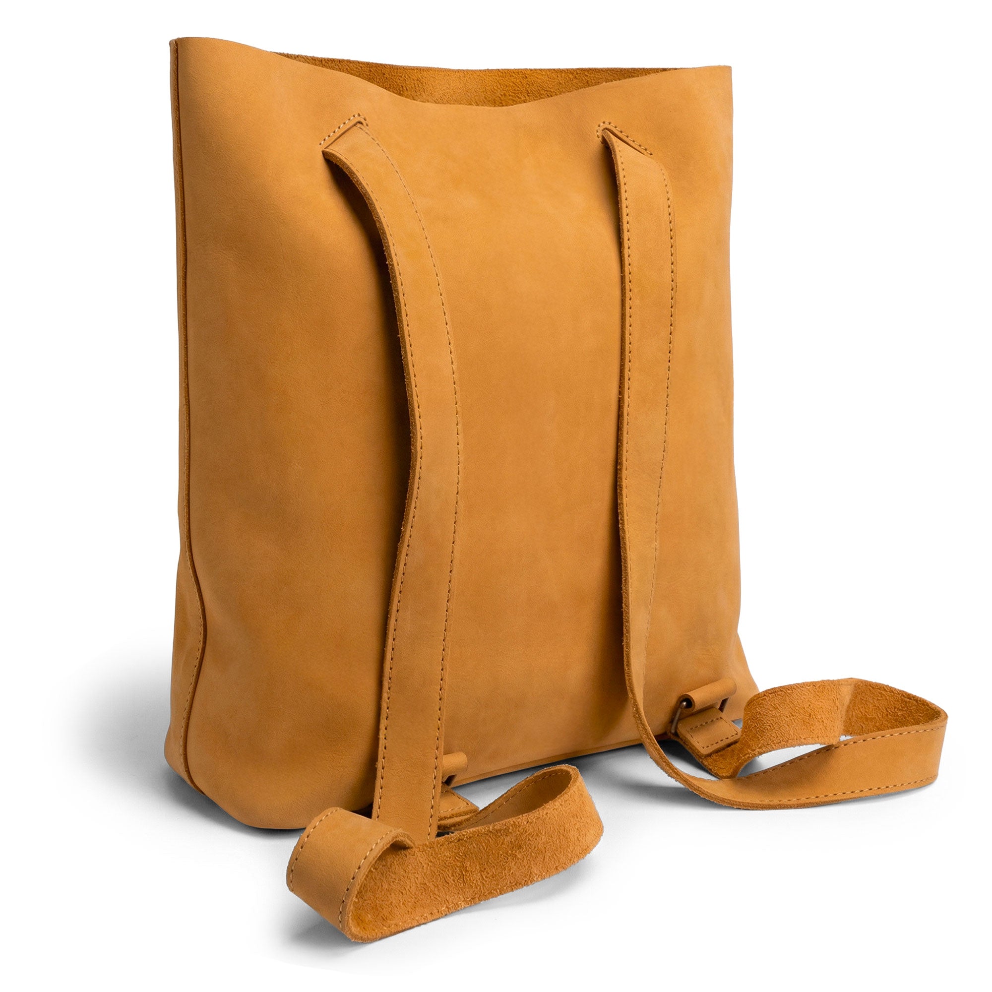 Side view of the Convertible Backpack to Shoulder Bag by Heather's, highlighting the adjustable straps. This stylish squared purse made of Full Grain Leather is perfect for women and features small batch production techniques, including hand cut and hand sewn craftsmanship. Handmade in La Antigua Guatemala & Oaxaca Mexico.