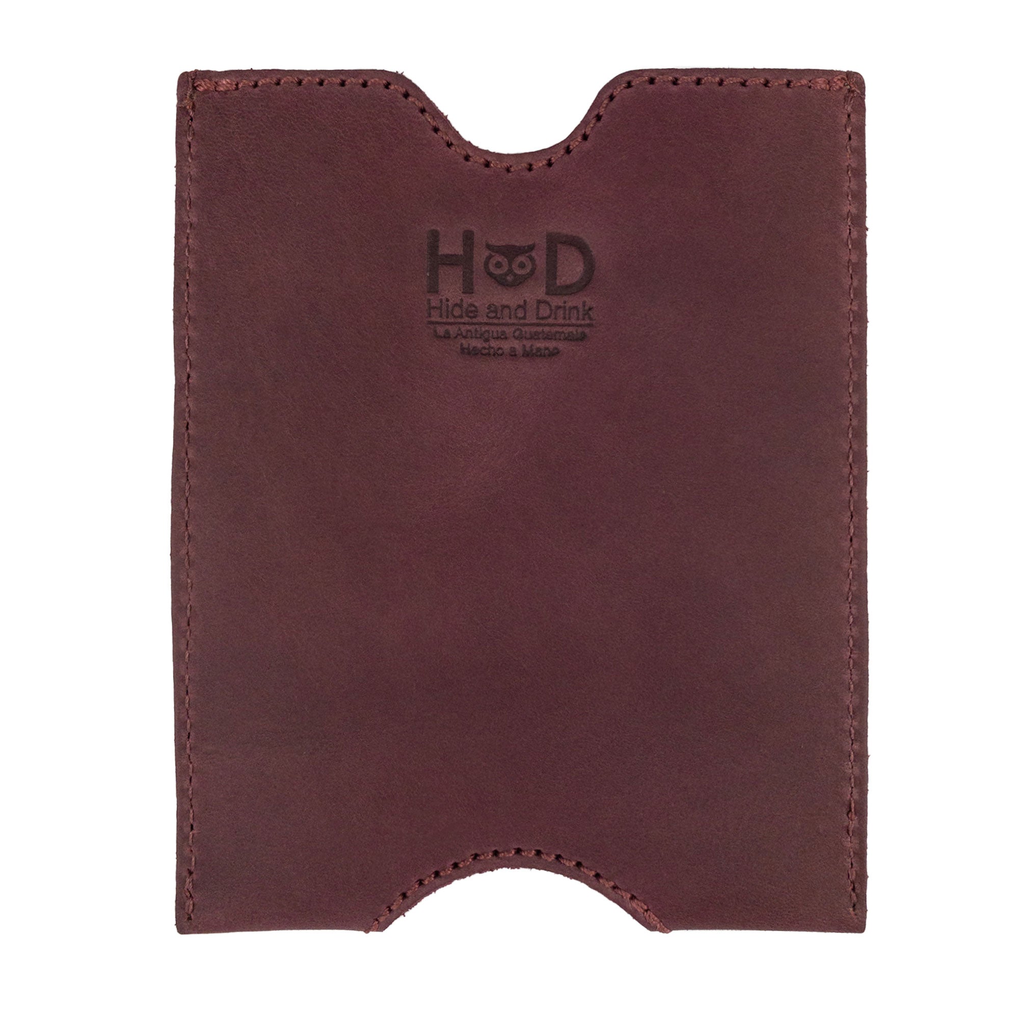 Back view of the Hide & Drink Passport Sleeve in a rich burgundy color, made from Full Grain Leather, showcasing its design as a Travel Passport Pocket Sleeve. This artisan product emphasizes small batch production and is handmade in La Antigua Guatemala & Oaxaca Mexico, with fire branded details enhancing its charm.