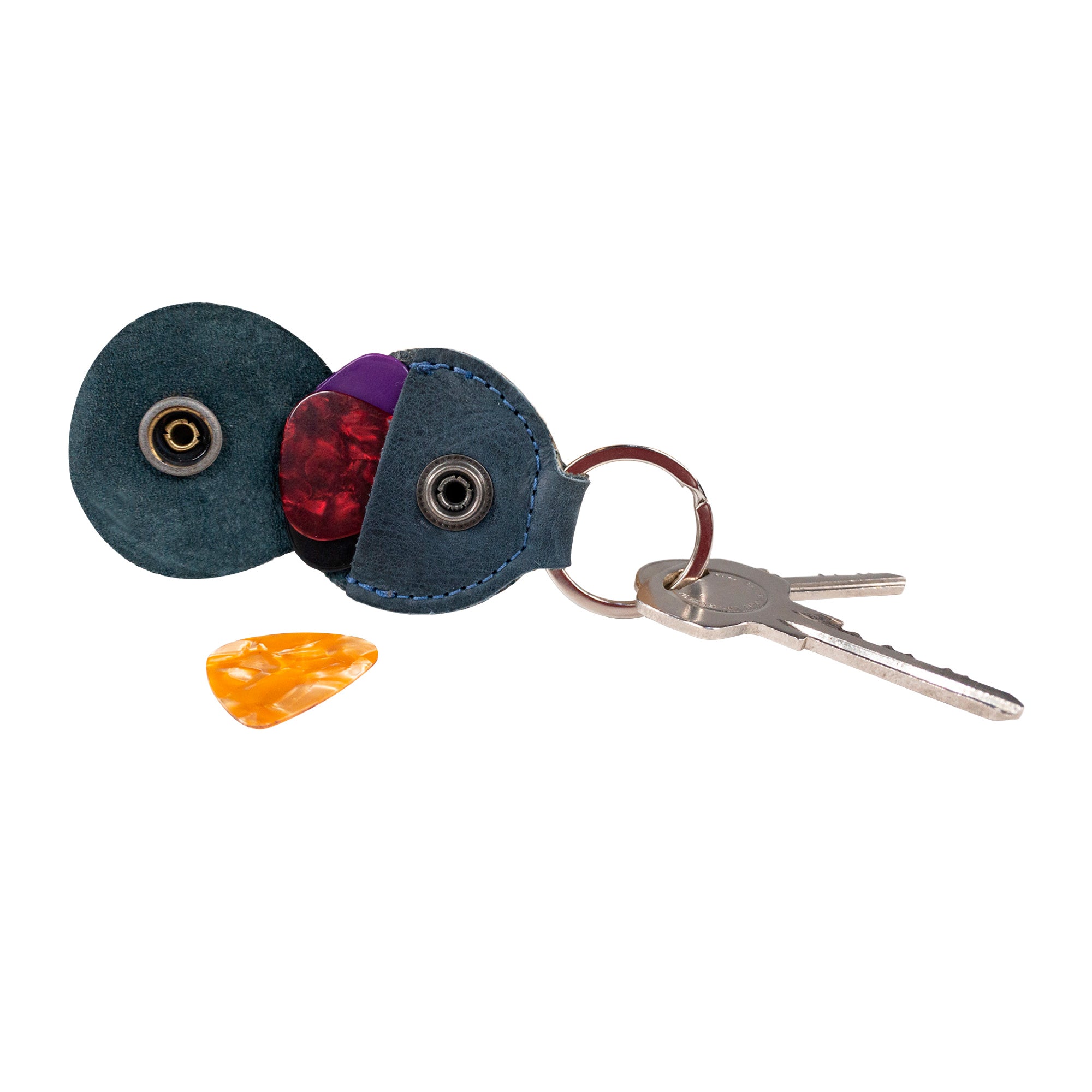 Side view of the Key Chain & Guitar Pick Holder by Hide & Drink, highlighting the convertible Guitar Pick Holder with Ring. This versatile keychain for guitar players is made from premium Full Grain Leather, crafted through small batch production with meticulous hand cut and hand sewn techniques, showcasing artisan quality and fire branding, handmade in La Antigua Guatemala & Oaxaca Mexico.