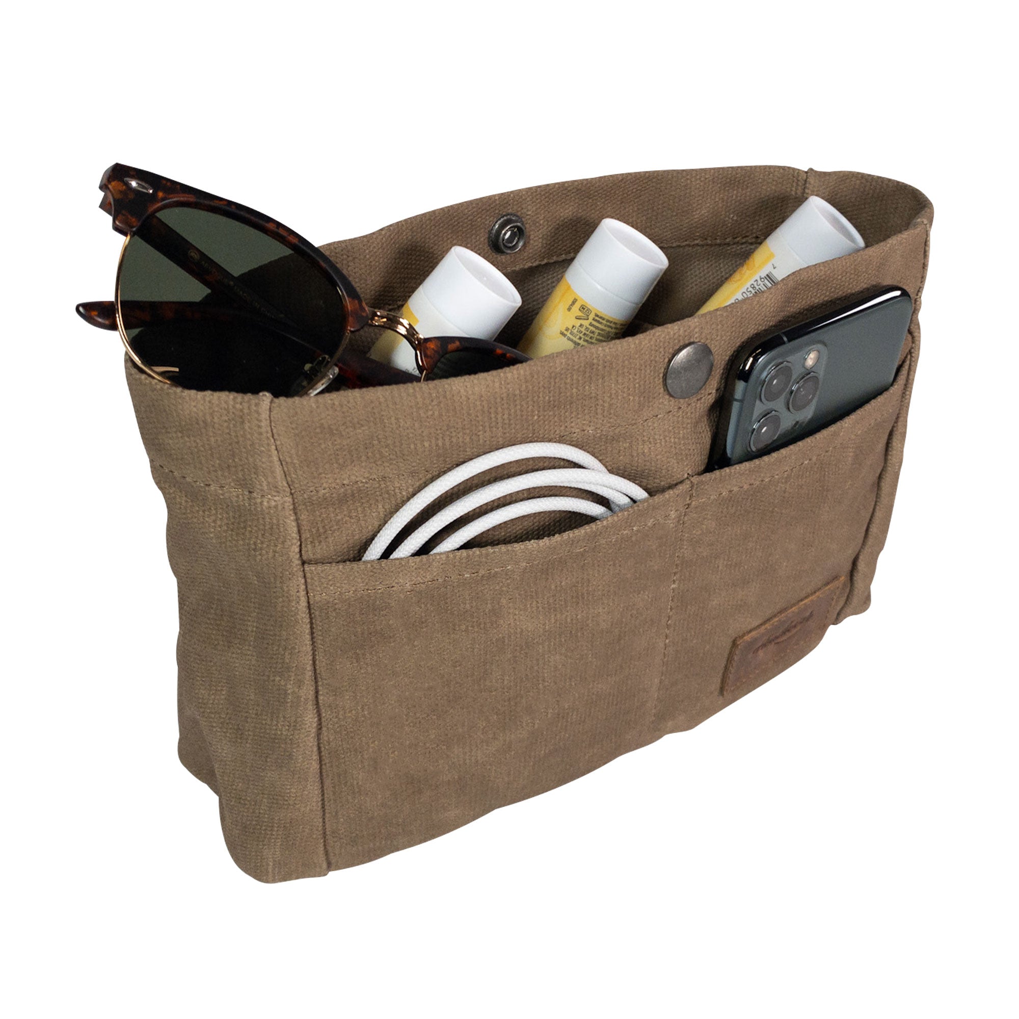 Heather's Purse Organizer Insert in action, showcasing its Waxed Canvas material. Ideal for keeping sunglasses, lip balms, and cords organized in handbags or tote bags. Designed as a practical travel accessory, handmade with care in La Antigua Guatemala & Oaxaca Mexico.
