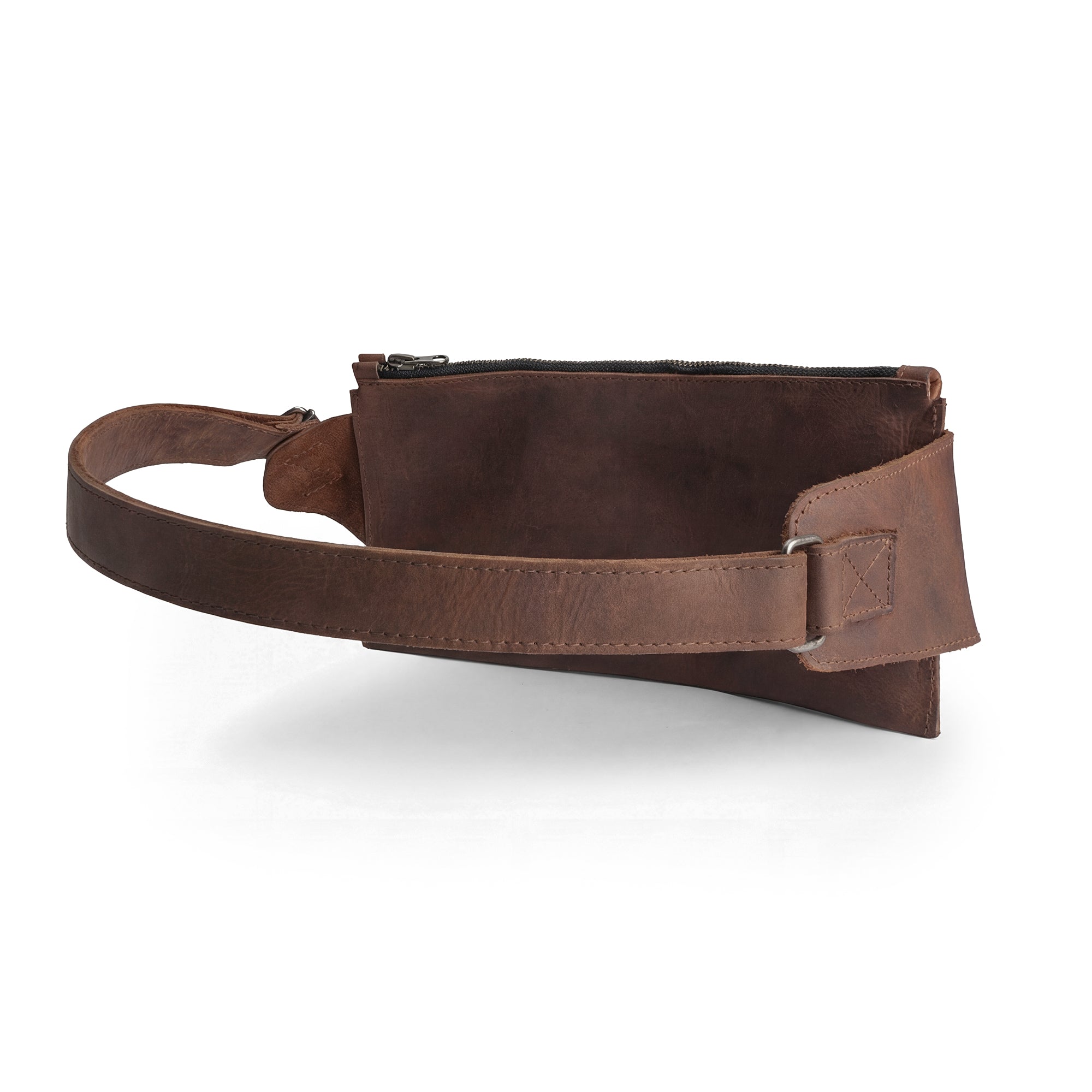 The minimalist design of the Crossbody Multi-Pocket Bag by Hide & Drink highlights its functionality and elegance. Made from durable full grain leather, this Crossbody Bag serves as a Messenger Bag and Shoulder Bag, ideal for everyday use. This handmade artisan product reflects small batch production techniques from La Antigua Guatemala & Oaxaca Mexico.