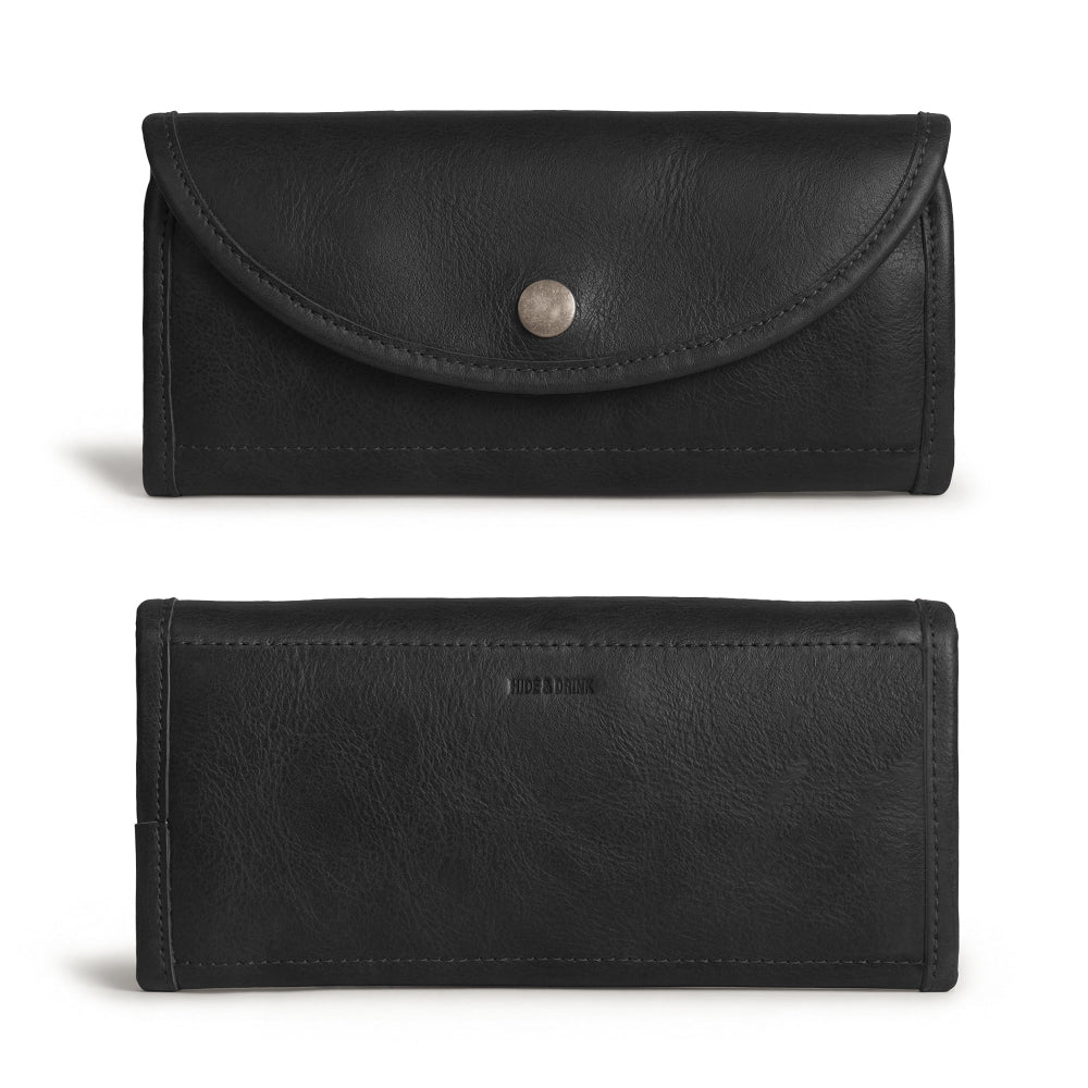 Back view of the black Single Snap Zippered Wallet by Hide & Drink, highlighting its stylish features. This Snap Clutch Wallet for Women is a functional money holder and card organizer with a zippered pouch, designed from full grain leather and expertly handcrafted in La Antigua Guatemala.