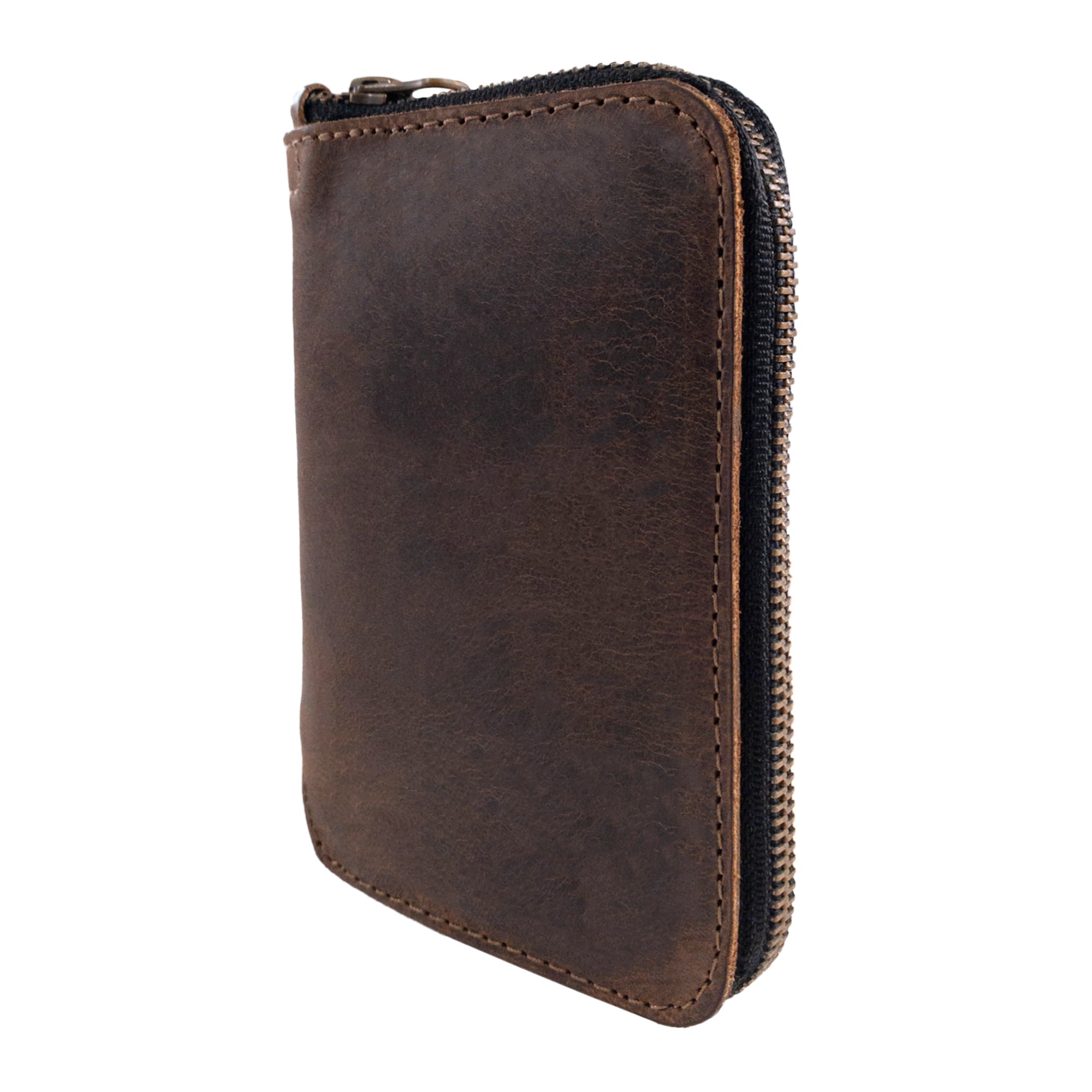 Side profile of Hide & Drink's Zippered Journal Cover for Moleskine (Notebook NOT Included) showcasing its durable leather construction. This protector sleeve is handcrafted and fire branded, made in small batches.