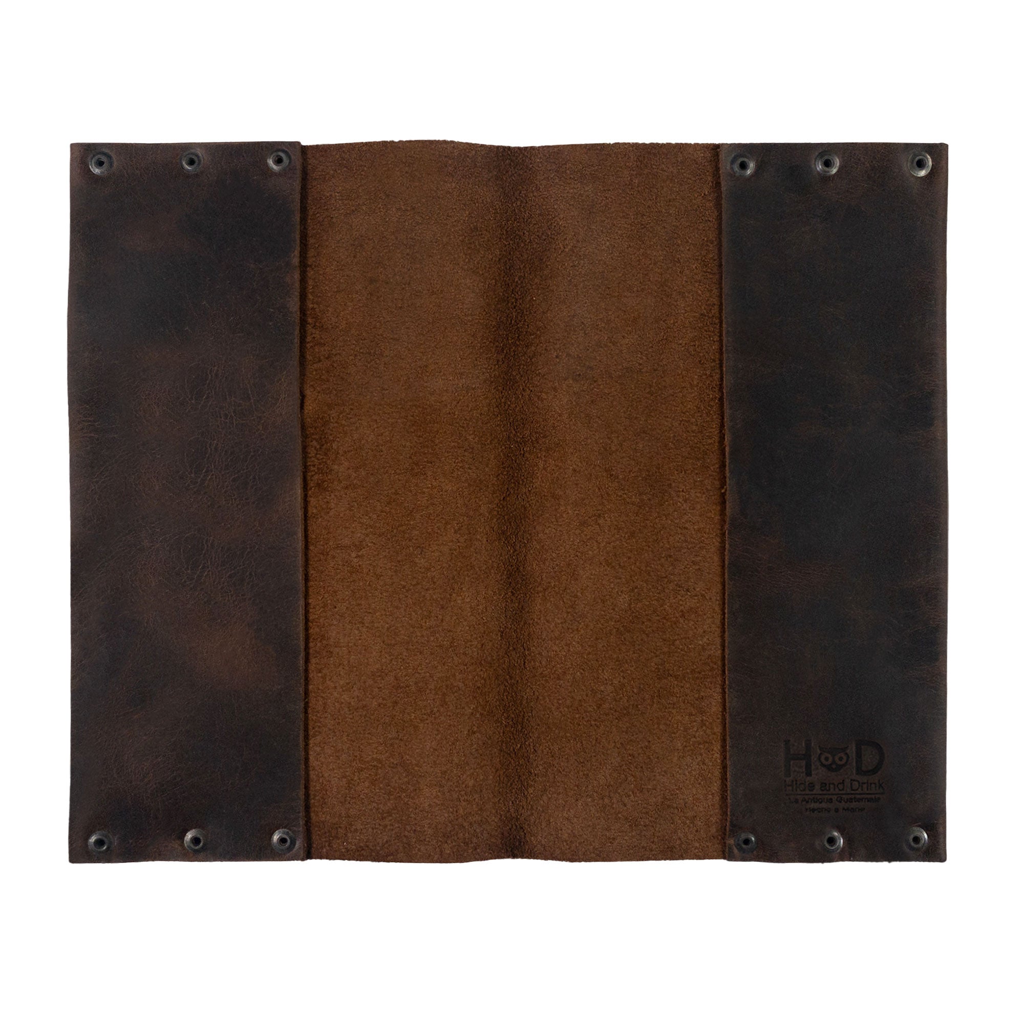 The inside view of Hide & Drink's Riveted Journal Cover (5 x 8.50 in.) (Notebook Not Included) reveals its classic sleeve design, highlighting the vintage style and rich texture of full grain leather. This artisan-crafted product is hand cut and hand sewn, featuring small batch production methods, and fire branded, embodying the craftsmanship of skilled artisans in La Antigua Guatemala & Oaxaca Mexico.
