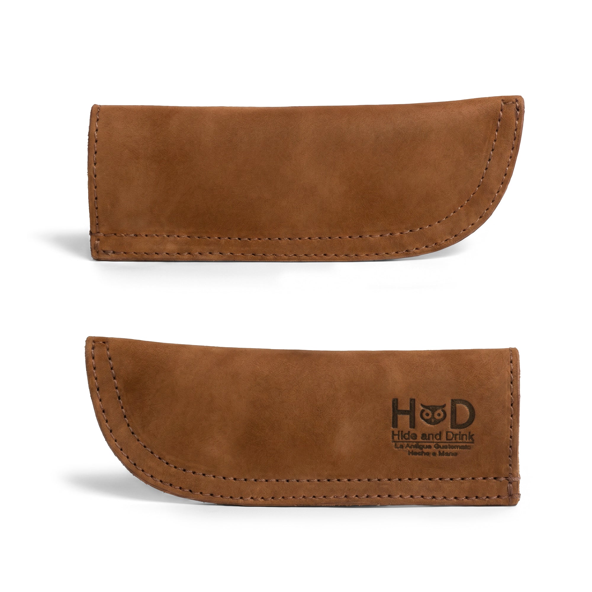 Hide & Drink Cast Iron Panhandle Cover in a stylish angle, highlighting its craftsmanship. As a hot handle protector, it's designed for easy application on metal skillets and is crafted with double layered full grain leather. Handmade in La Antigua Guatemala & Oaxaca Mexico, it's a must-have for every cooking enthusiast.
