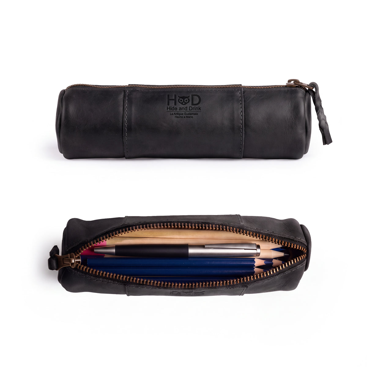 Side view of the Utility Cylinder Case by Hide & Drink highlighting its robust zipper, perfect for securing office supplies or personal items. This classic, handmade bag features Full Grain Leather craftsmanship. Cylinder Case, Handmade, Rustic.