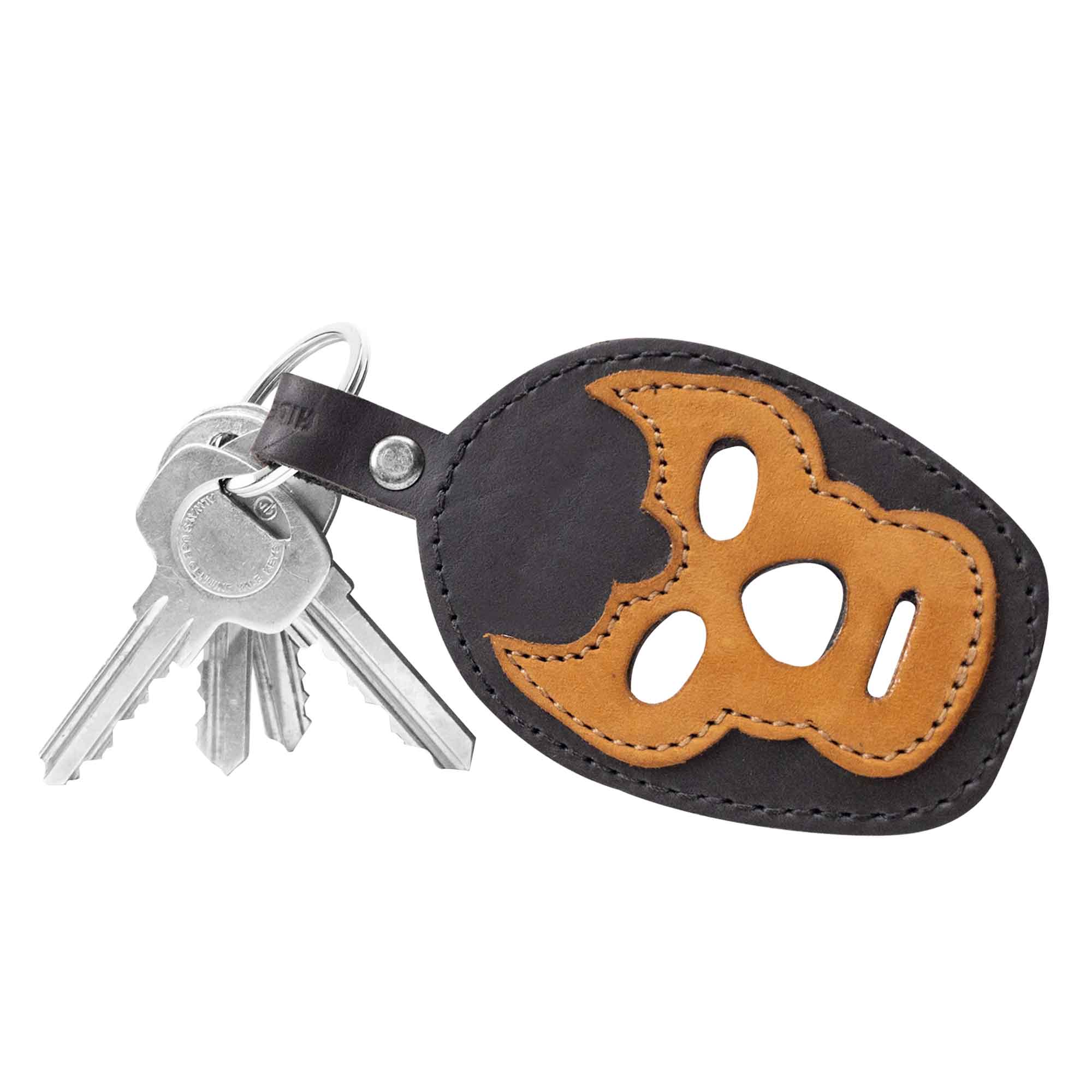 A colorful variant of the Luchador Mask Leather Keychain, showcasing its unique design features. This keyring from Hide & Drink is not just a key organizer, but an artisan travel accessory made from premium full grain leather, representing the small batch production ethos, handmade in La Antigua Guatemala and Oaxaca Mexico.