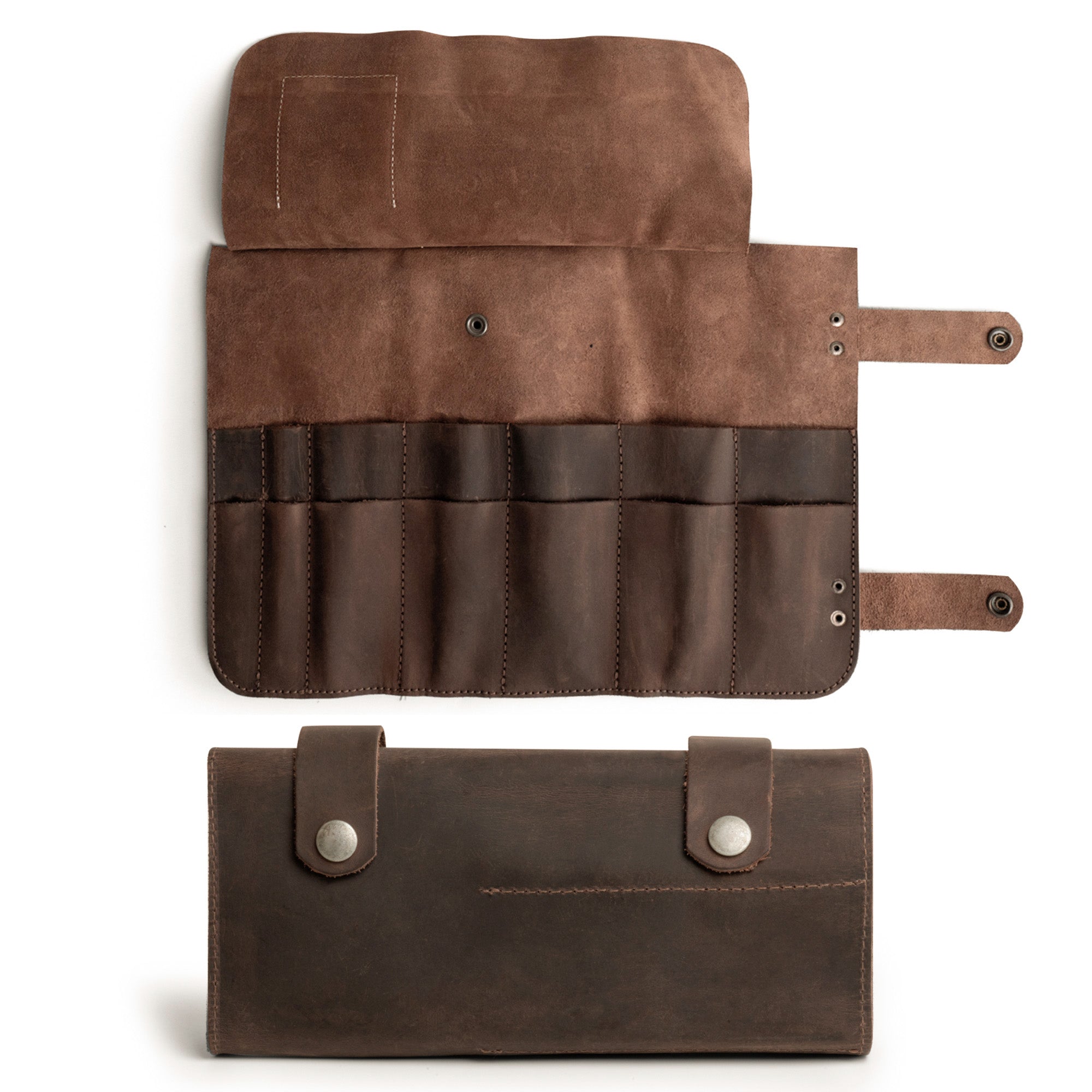 Close-up view of Hide & Drink's Barber Tool Roll, this Snap Tool Roll Up Bag with 14 Slots is ideal for scissors & screwdrivers. Made from Full Grain Leather, this portable carry case emphasizes StockyardX's small batch production ethos and artisan craftsmanship, hand cut, hand sewn, and fire branded in La Antigua Guatemala & Oaxaca Mexico.