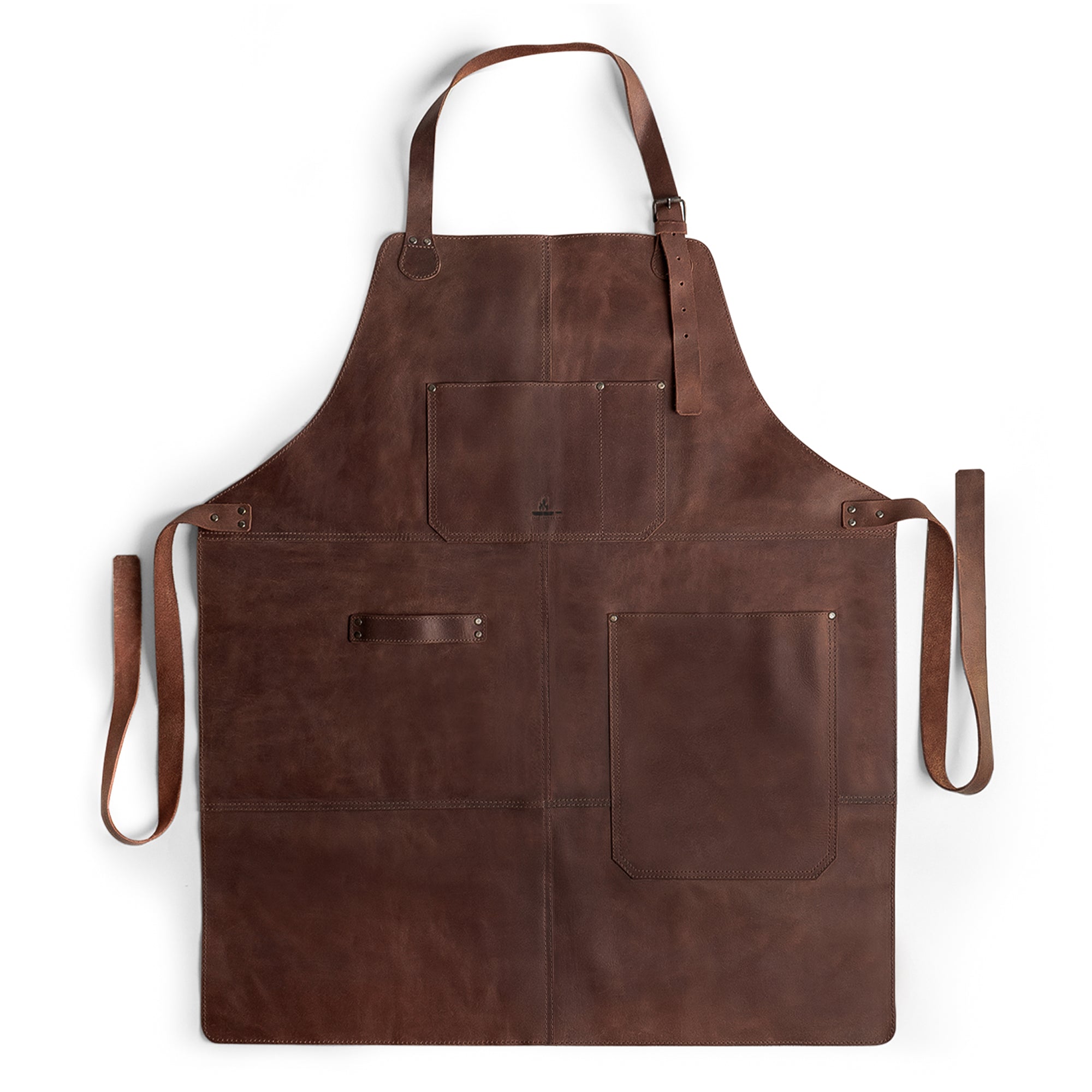 High-quality Grill Apron from Cast Leather Co., showcasing a sleek design with functional pockets, serving as a Protective Clothing Cover for Cooking and Grilling. Crafted from durable Heat Resistant Full Grain Leather, this apron is a great addition to your kitchen attire. Artisan crafted, this Handmade piece reflects Small Batch Production from La Antigua Guatemala & Oaxaca Mexico.