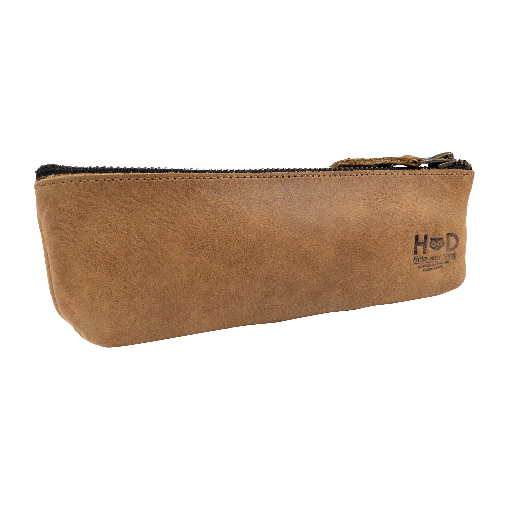 The Hide & Drink Pencil Pouch, featuring a luxurious full grain leather design, shown from a side angle. This rectangular pencil case serves as a practical pen & marker pouch for men and women, with a flat zippered holder. Handmade in La Antigua Guatemala & Oaxaca Mexico, known for its artisan quality and small batch production.