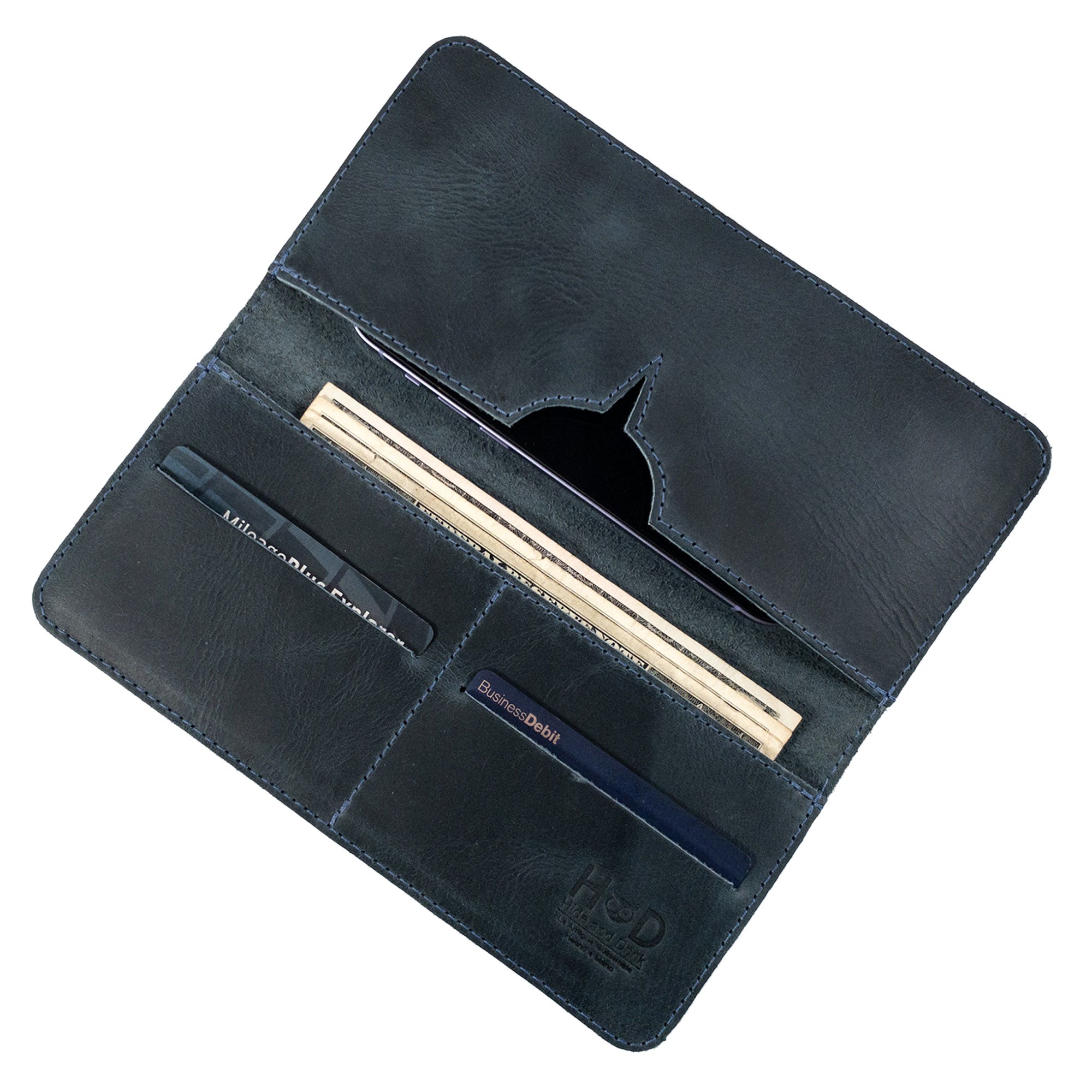 Open bifold wallet for cellphone by Hide & Drink, featuring compartments for cards and cash. This stylish Bifold Wallet for Cellphone is crafted from premium Full Grain Leather, blending practicality with elegance. Discover the artisan quality from small batch production in La Antigua Guatemala & Oaxaca Mexico.