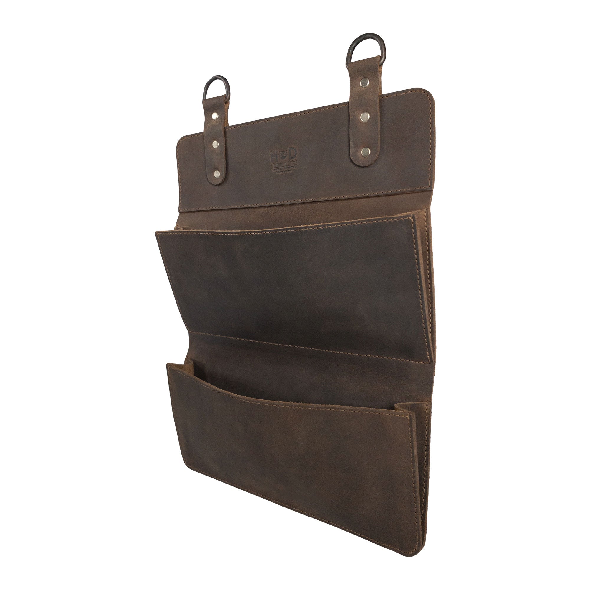 Hide & Drink Double Document Holder for Hanging viewed from the side, showcasing its elegant design for wall mount file storage. Crafted from full grain leather, this product highlights artisan skills, featuring small batch production, hand cut, and hand sewn details with a fire branded finish, handmade in La Antigua Guatemala & Oaxaca Mexico.