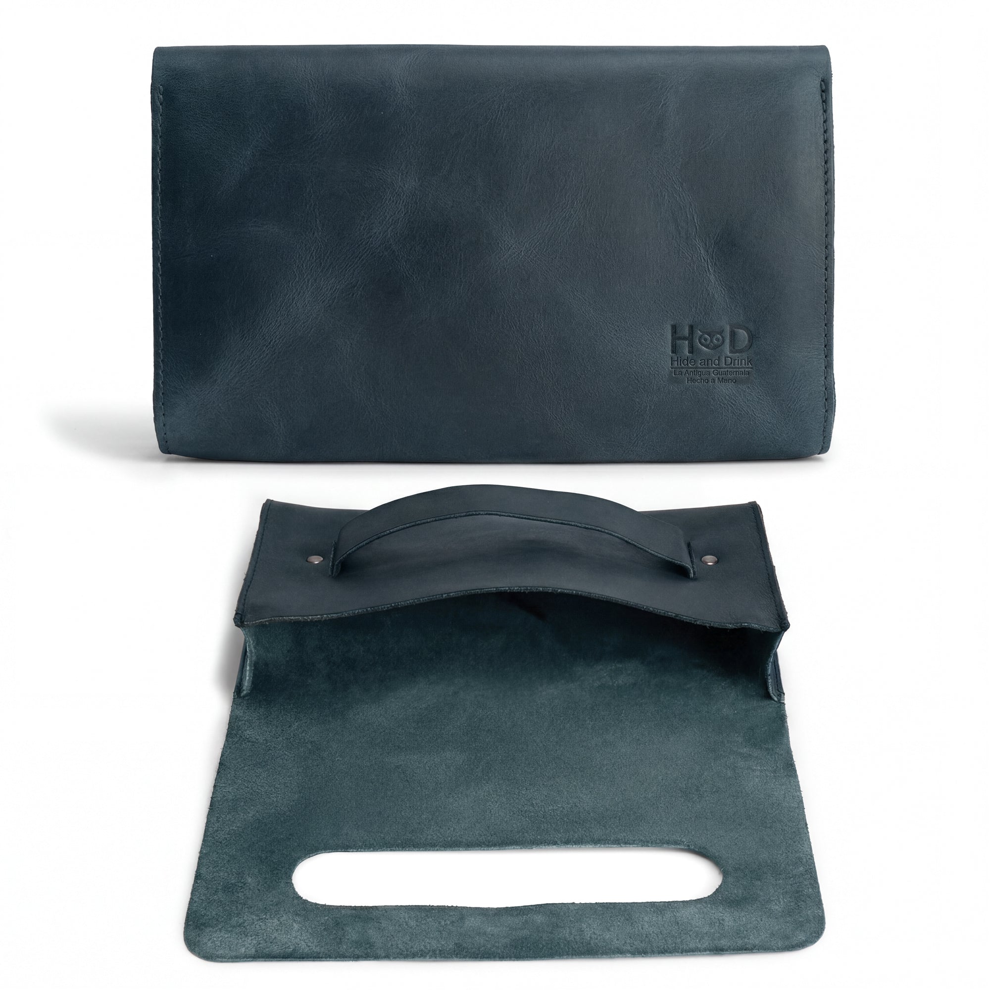 Open interior of the navy Clutch Bag With Handle by Hide & Drink, demonstrating its functional elegance. This Full Grain Leather Clutch Bag with Handle is perfect for women, crafted with artisan skill in La Antigua Guatemala & Oaxaca Mexico.