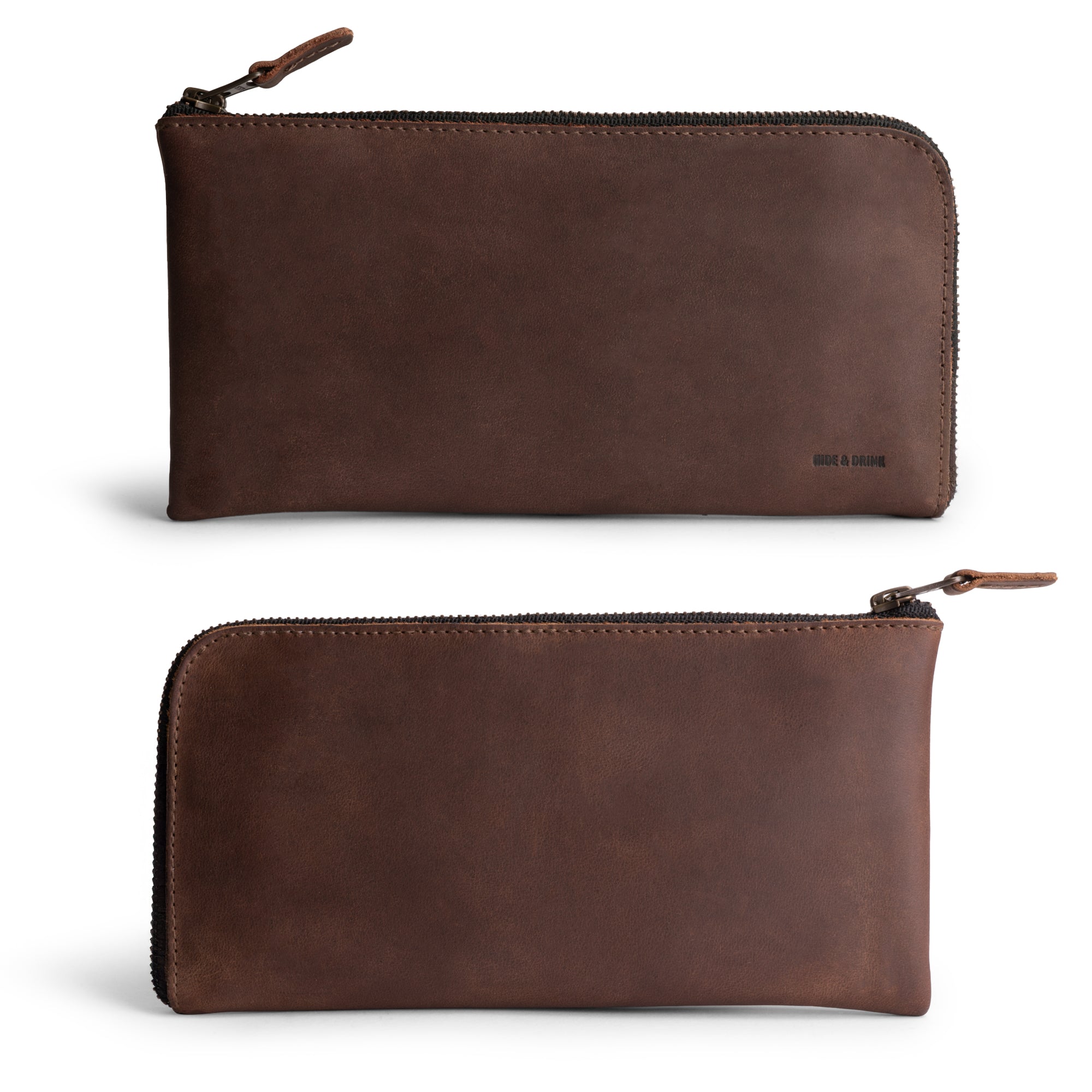 Front view of the Large Zippered Wallet by Hide & Drink, featuring smooth Full Grain Leather. This stylish Long Zippered Wallet for Men and Women is great as a Card Holder, Card Organizer, and Bill Holder, making it a perfect Travel Accessory. Every wallet is handmade with care in La Antigua Guatemala & Oaxaca Mexico, reflecting small batch production and artisan quality.