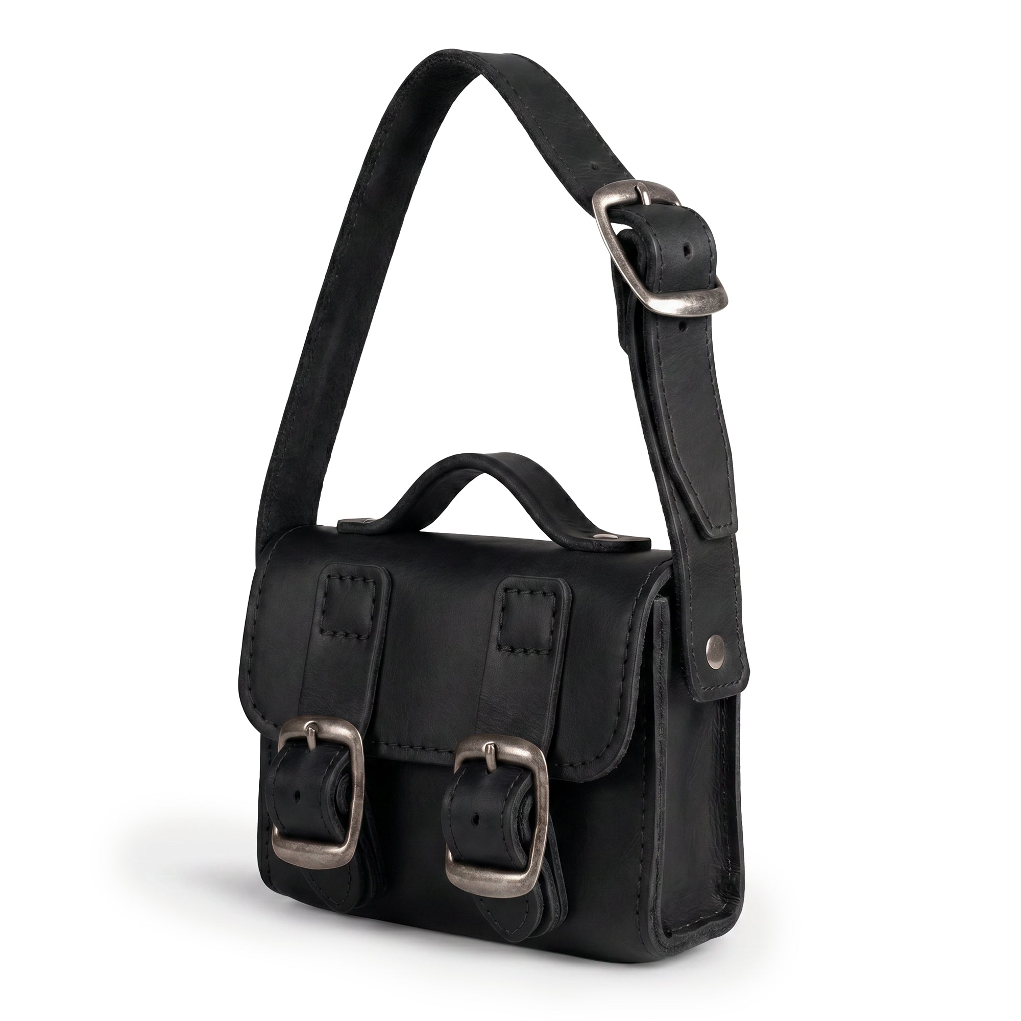 Side view of the Black Tiny Messenger Bag by Hide & Drink, emphasizing the quality and craftsmanship of this Mini Messenger Bag Charm made from durable Full Grain Leather. This artisan piece serves as a charming keychain and reflects handmade excellence from La Antigua Guatemala.