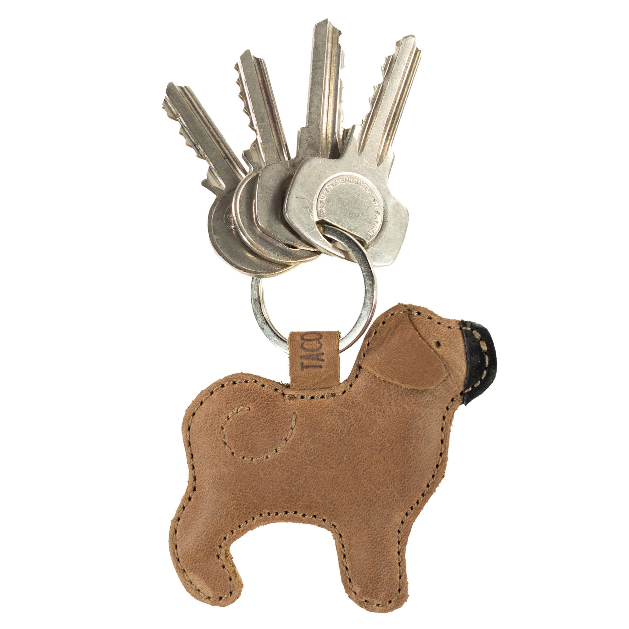 Pug Keychain from Taco Dog showcasing an adorable design while holding keys. This functional and durable keychain is made from all-natural full grain leather, offering a rustic look and unique handmade details. A perfect gift for pet enthusiasts, it is lightweight and suitable for any keychain collection. Artisan crafted in La Antigua Guatemala & Oaxaca Mexico.