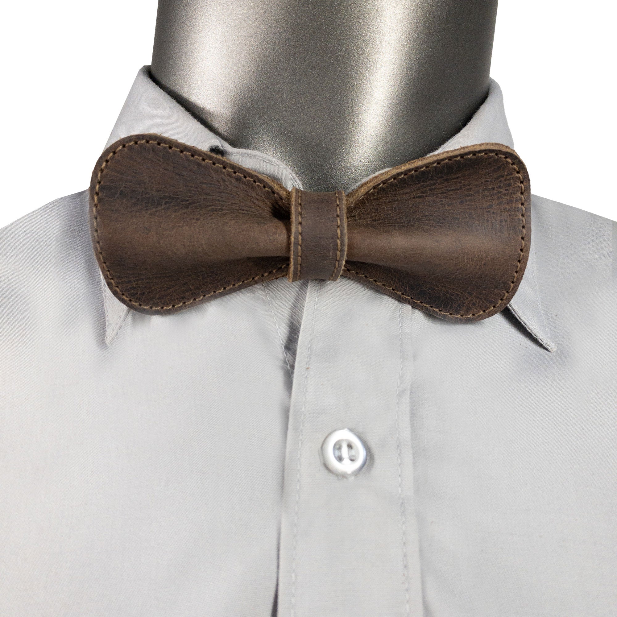 Rounded Bow Tie for Groomsmen by Hide & Groom shown on a mannequin wearing a shirt, showcasing the elegant and sophisticated design ideal for weddings and formal events. Crafted from durable full grain leather, this handmade accessory highlights artisan craftsmanship.