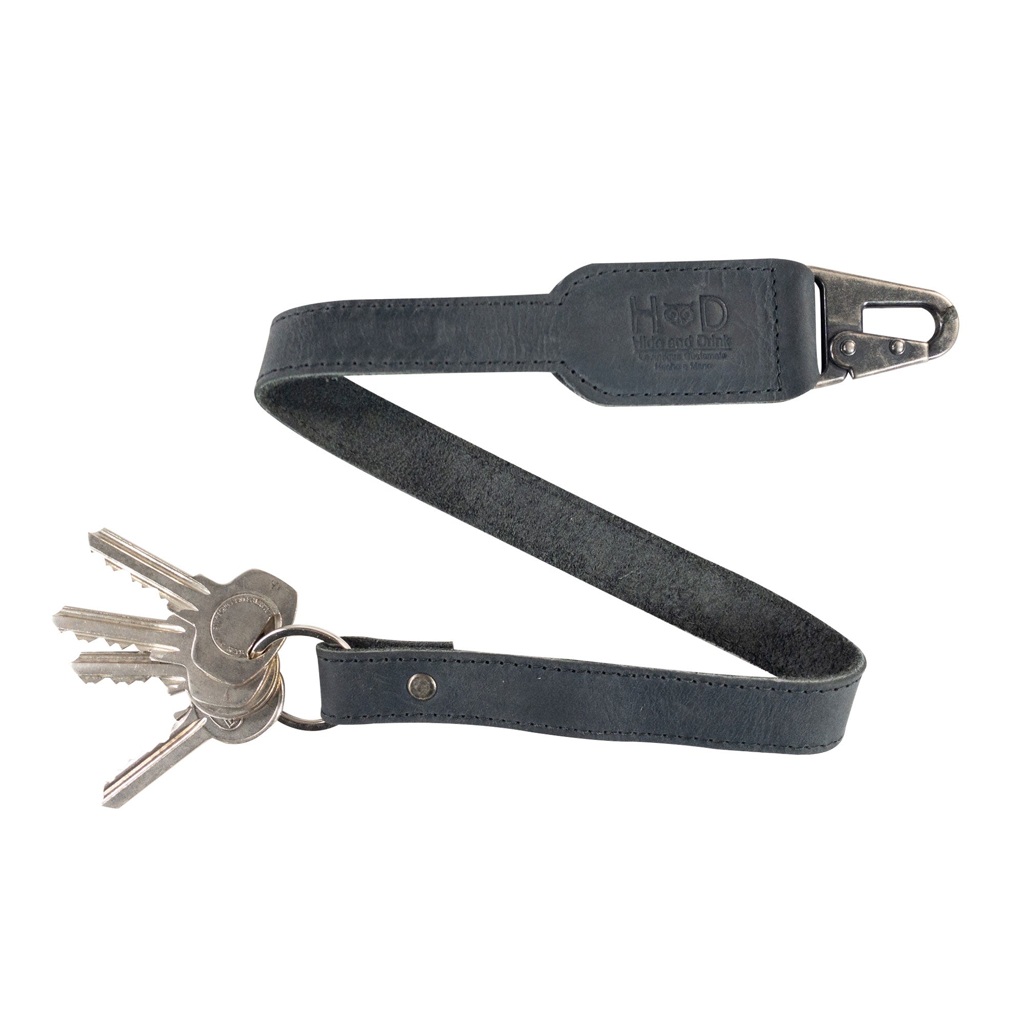 Hide & Drink Keychain Lanyard incorporating sleek Full Grain Leather with a practical clip for keys. This piece reflects small batch artisan craftsmanship, perfect for stylish organization.
