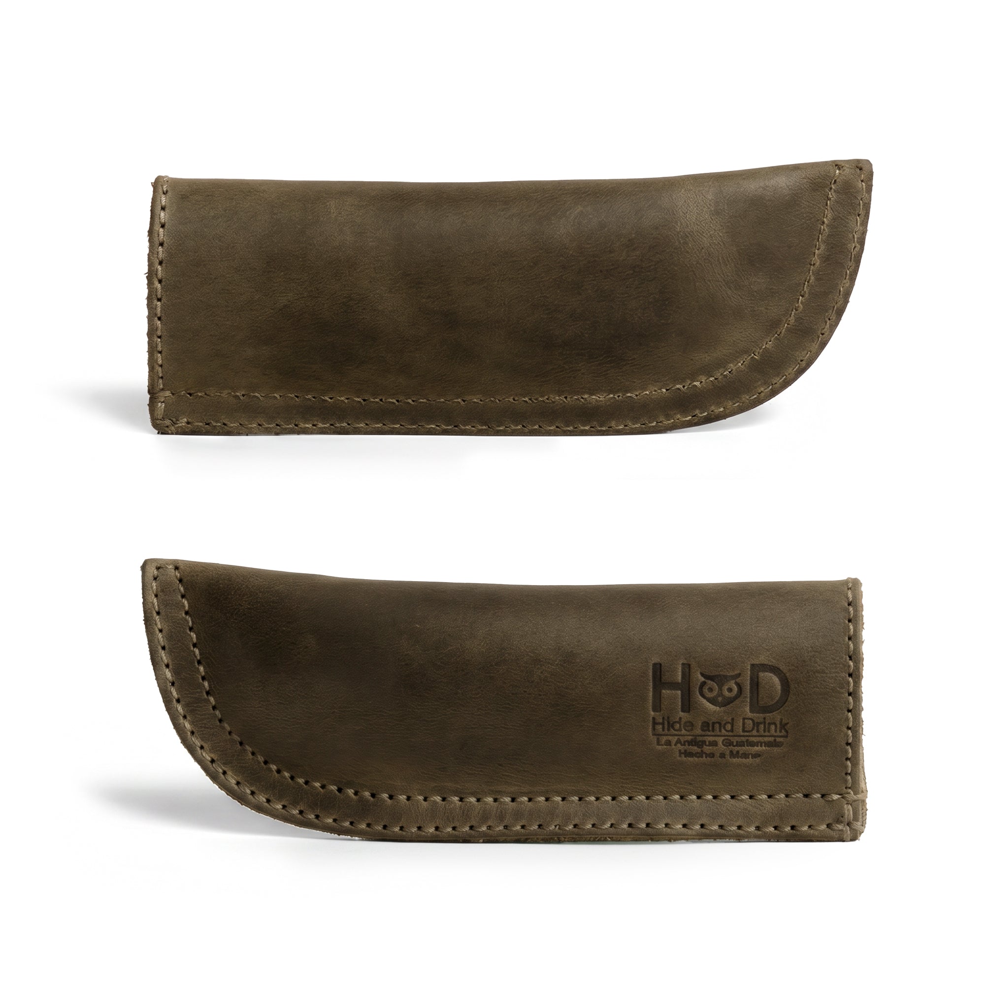 Hide & Drink Cast Iron Panhandle Cover showcased against a clean background. This artisan hot handle protector is made from durable full grain leather and features a double stitched design for strength. Handmade in La Antigua Guatemala & Oaxaca Mexico, it enhances both the safety and style of your kitchen.