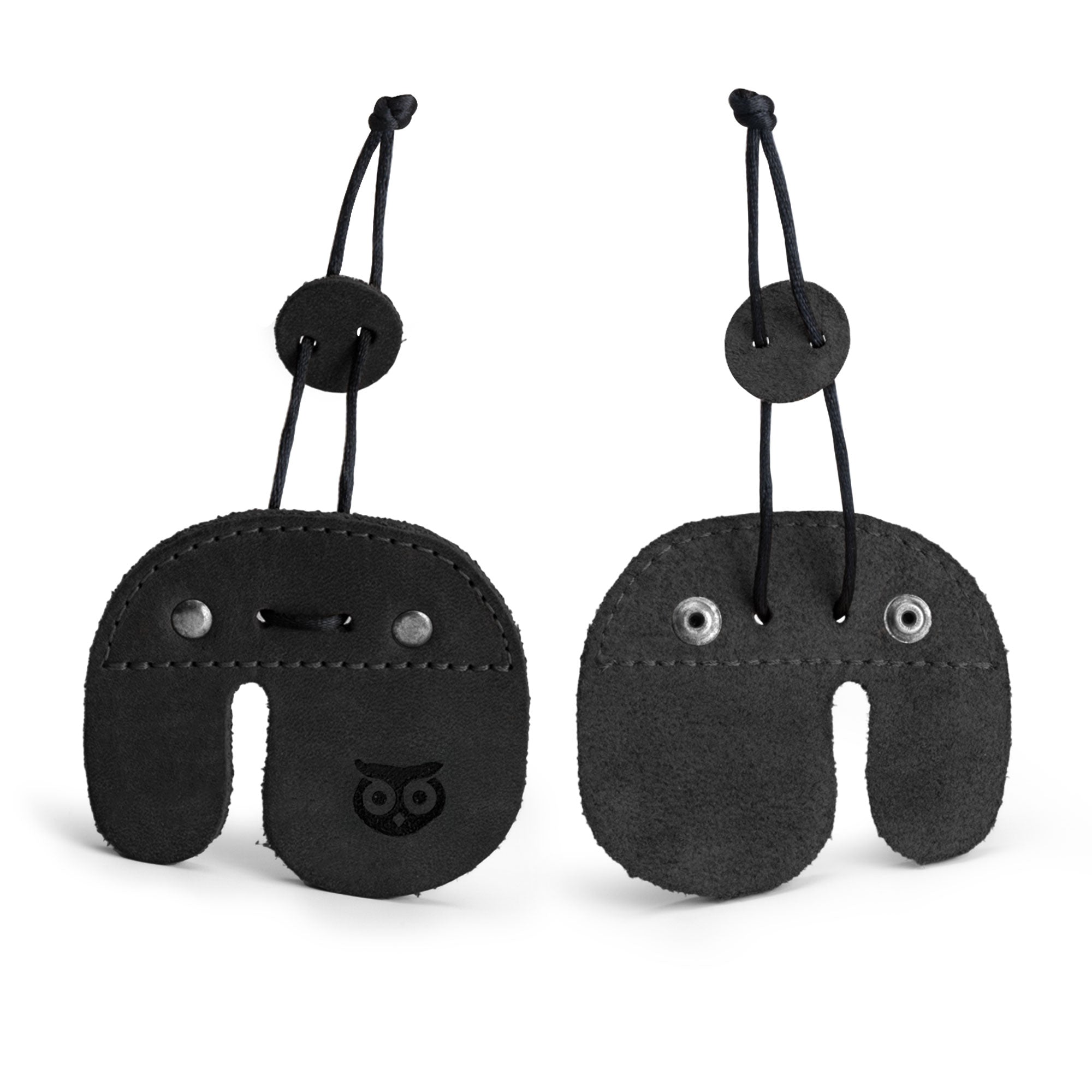 Right Handed Archery Finger Protector by Hide & Drink, displayed in elegant black leather, showcasing its dual side design. This Archery Finger Tab is the perfect Protect Guard for recurve bows, crafted from premium Full Grain Leather for optimal durability. It embodies Small Batch Production philosophies, with Hand Cut and Hand Sewn craftsmanship, and is fire branded by artisans in La Antigua Guatemala & Oaxaca Mexico.