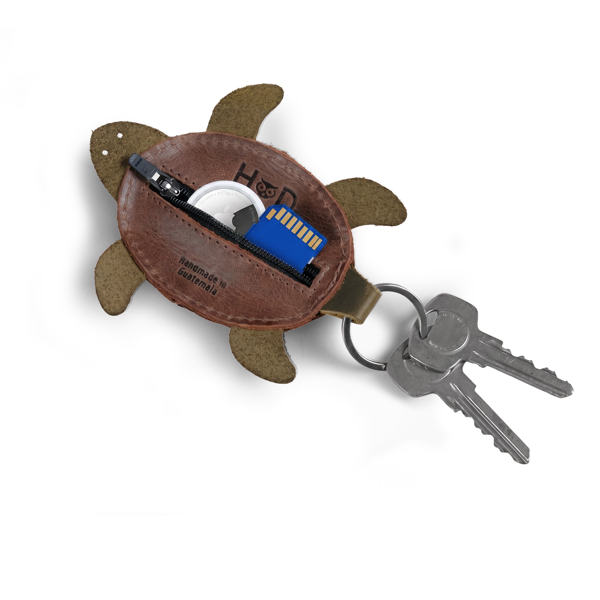 Turtle Mini Pouch Keychain by Hide & Drink, showing the interior storage for keys and small accessories. This versatile Leather Turtle Coin Purse is a perfect change pouch, crafted from Full Grain Leather with a handcrafted touch from La Antigua Guatemala.