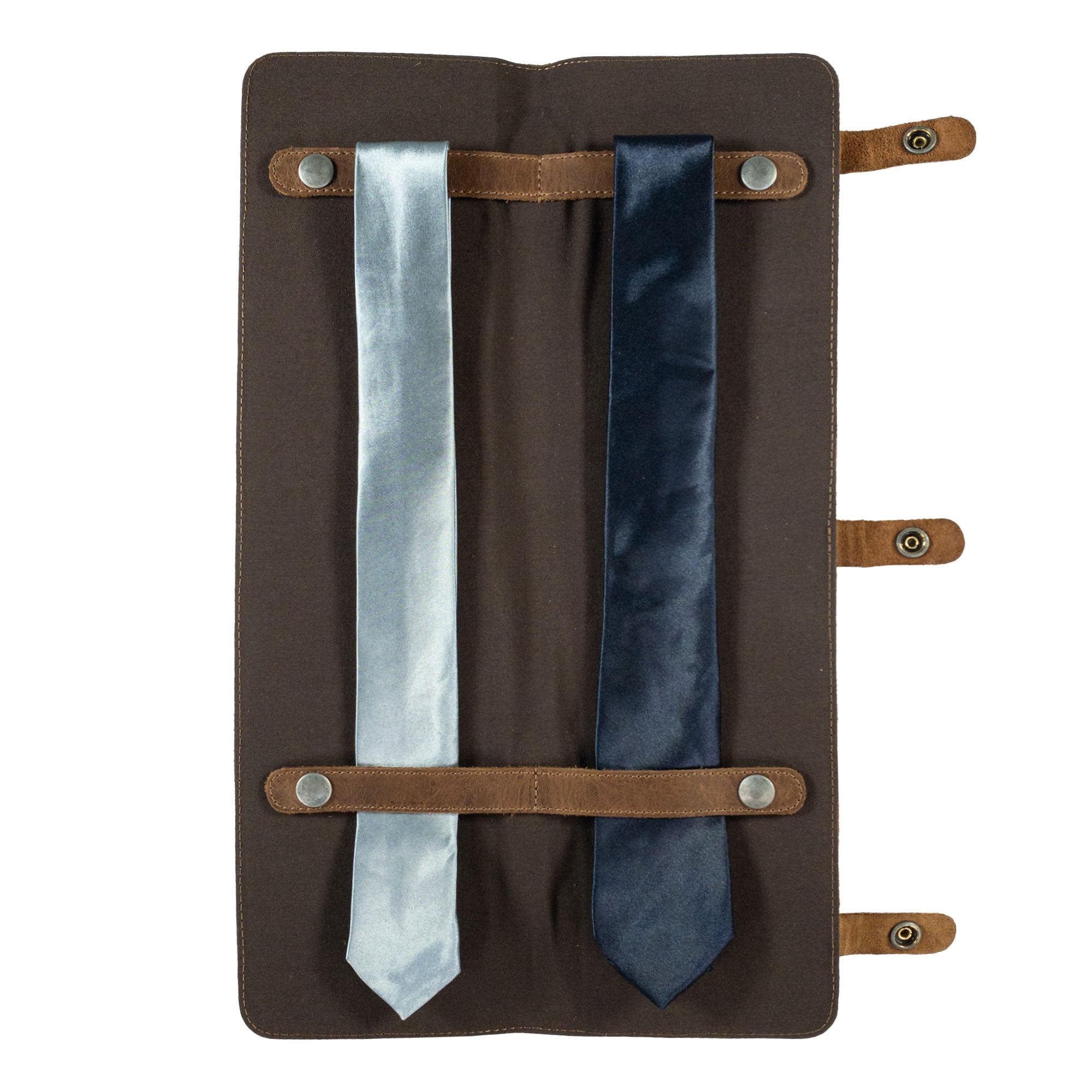 Interior view of the Travel Tie Case by Hide & Groom, displaying slots for two ties in full grain leather. Ideal for groomsmen and bachelor's events. This artisan product includes an extra pocket for accessories, showcasing small batch production.