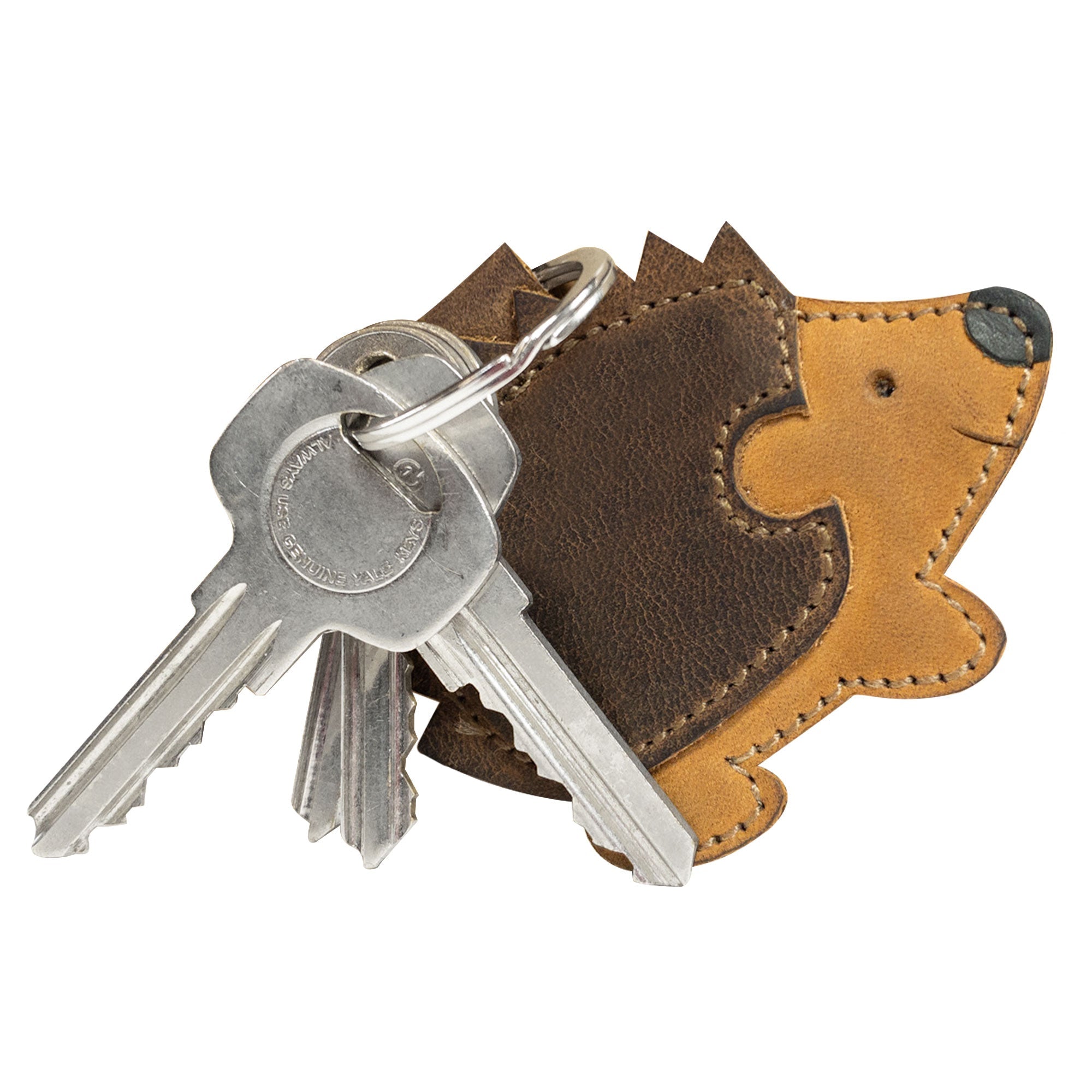 Close-up of the Porcupine Keychain, showcasing its unique leather texture and adorable design. Made by Hide & Drink, this key ring holder is a perfect accessory for wildlife enthusiasts. Crafted from Full Grain Leather, it features artisan craftsmanship, small batch production, and fire branded elements, handmade in La Antigua Guatemala & Oaxaca Mexico.