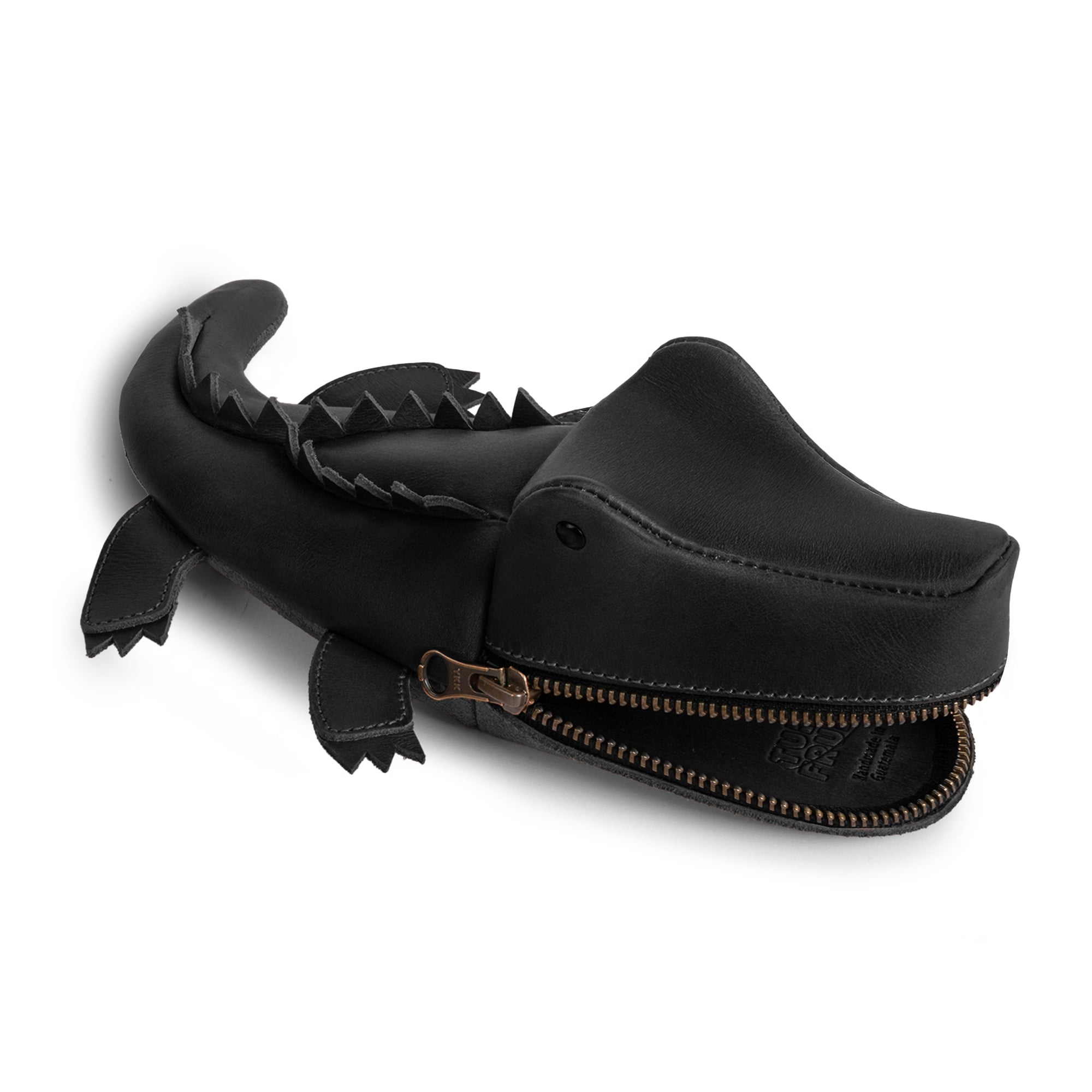Close-up view of the Leather Gator Pouch from Tudi Frudi, showcasing its premium full grain leather craftsmanship. This alligator-shaped pouch serves multiple purposes, including as a stylish pencil case, small charger cable holder, and change bag, all handmade by artisans in La Antigua Guatemala & Oaxaca, Mexico.