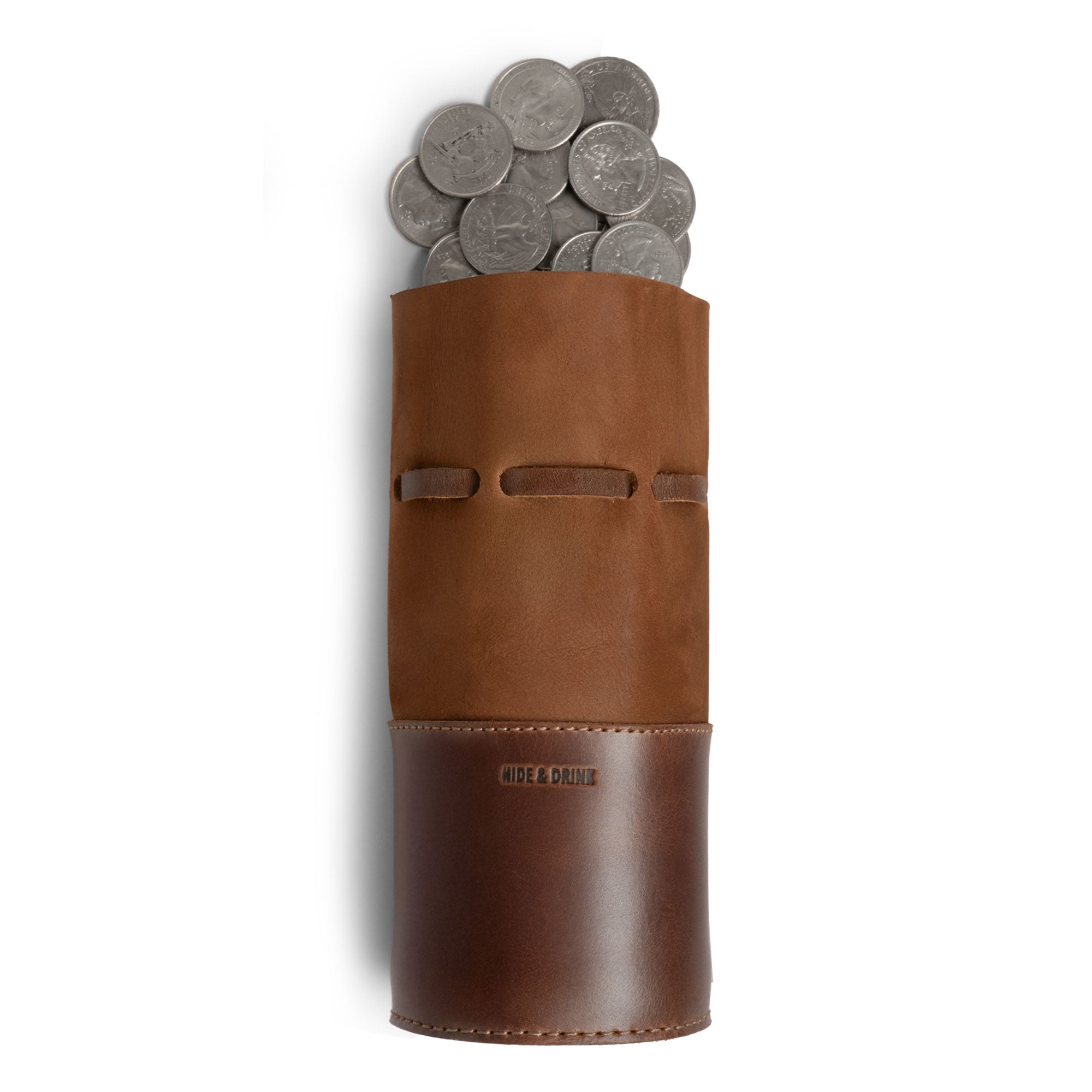 The Medieval Bucket Coin Release by Hide & Drink features a filled coin pouch, perfect for storing your change neatly. This medieval money box combines a sleek design with functionality as a coin pouch and cash organizer, crafted from full grain leather through small batch production by skilled artisans in La Antigua Guatemala & Oaxaca Mexico.