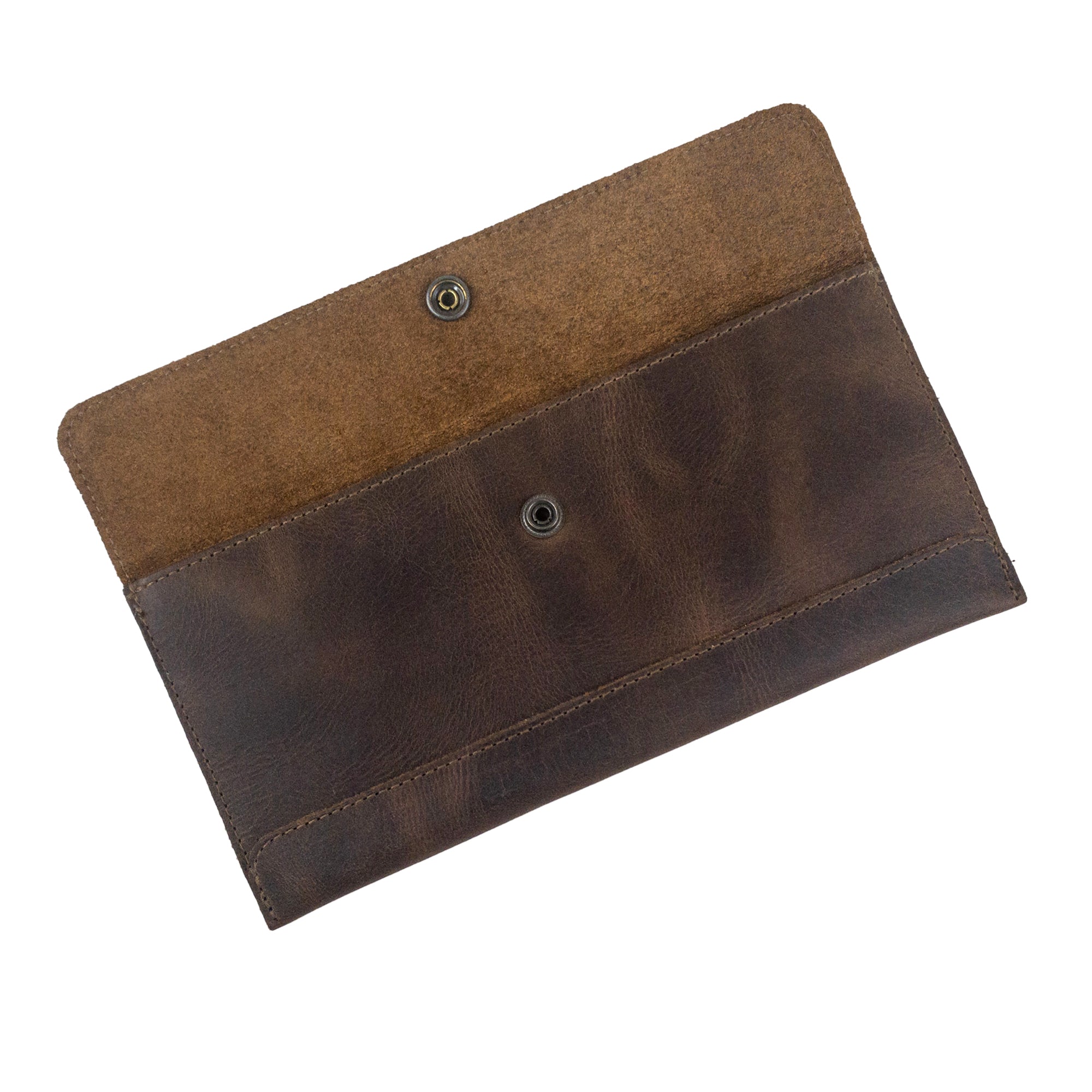 An open view of Hide & Drink's Travel Hand Wallet, highlighting its elegant Full Grain Leather texture. This versatile Travel Wallet is expertly hand cut and sewn, made by artisans in La Antigua Guatemala & Oaxaca Mexico.