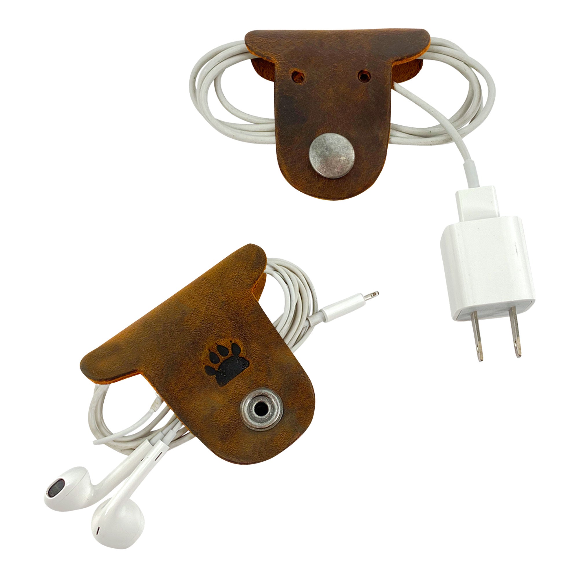 Organize your earbuds and chargers with these unique Dog Cord Keepers by Taco Dog. Made from full grain leather, this 2 pack is designed for easy cable management and travel, clipping together effortlessly. Experience artisan, handmade quality from La Antigua Guatemala with these adorable accessories.