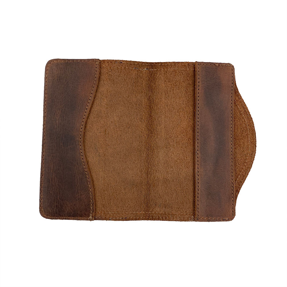 An architectural overview of the Hard Cover Notebook Protector (Notebook NOT Included) by Hide & Drink, revealing its distinct features. Made for Moleskine Hard Cover Sketchbook XXL Size (8.5 x 11 in.), Notebook NOT Included, this journal cover includes Full Grain Leather sourced from StockyardX, showcasing artistry in small batch production with hand cut, hand sewn, and fire branded processes by artisans. Handmade in La Antigua Guatemala & Oaxaca Mexico.