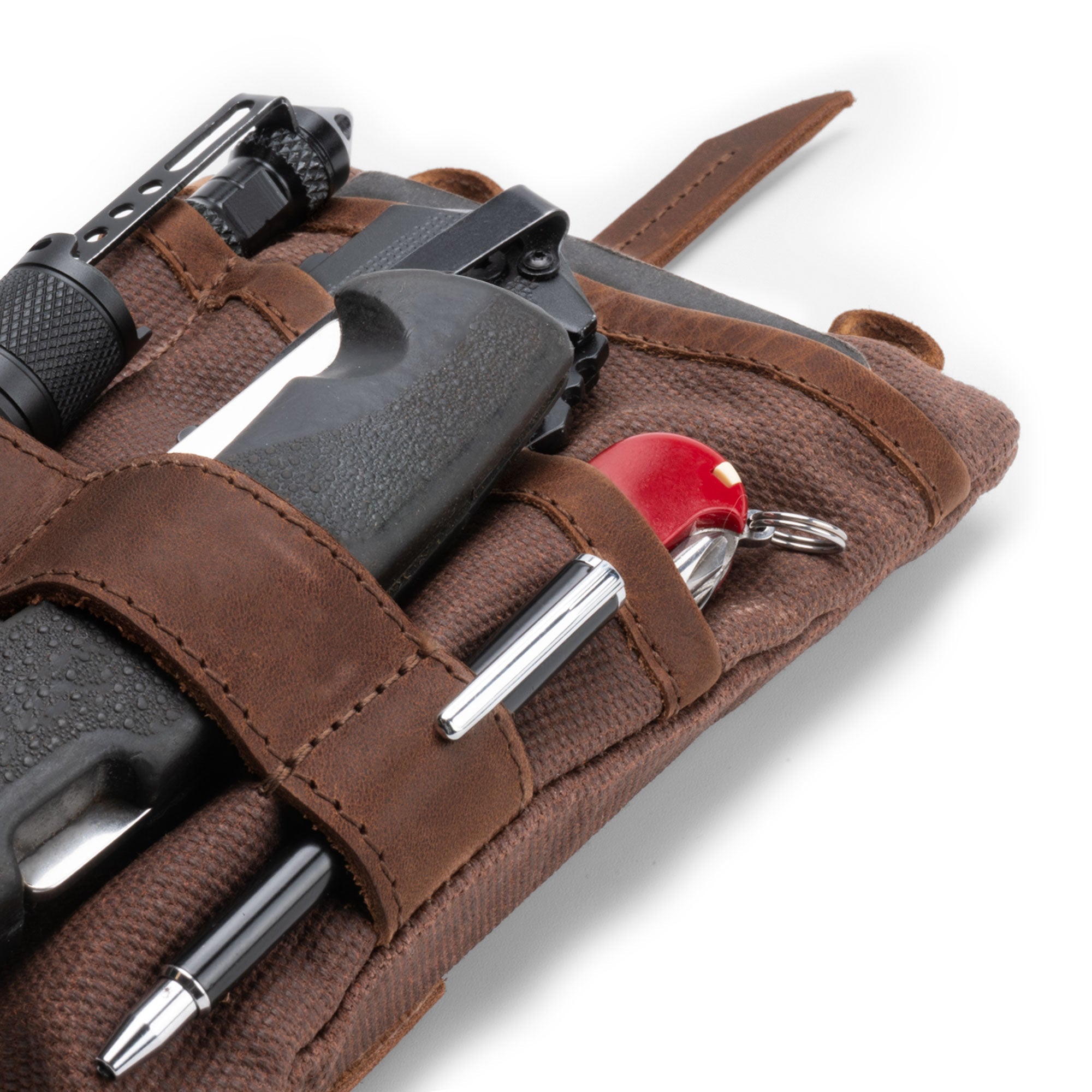 Side view of the brown Multi-tool Pocket Pouch - XL by Hide & Drink, highlighting the zippered closure and durability perfect for outdoor adventures. Multi-Tool Pocket Pouch XL, Mini Camping Tool Case, Handmade Slim Organizer, Waxed Canvas, StockyardX, Small Batch Production, Artisan, Handmade in La Antigua Guatemala & Oaxaca Mexico.