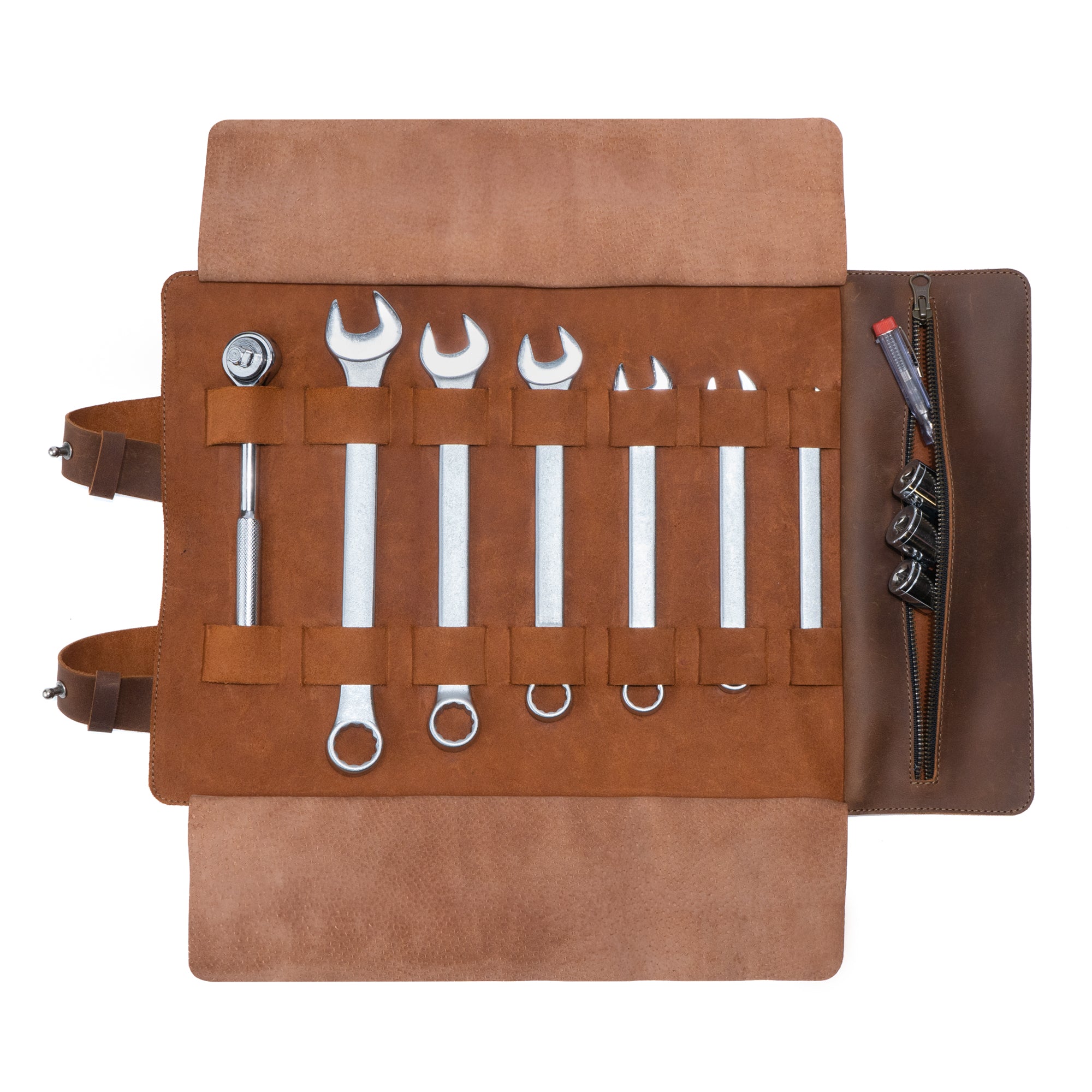 Open Tool Roll for Bikers showcasing a variety of wrenches secured with fabric straps, made by Hide & Ride. This Motorcycle Tool Bag features a unique design, perfect as a Universal Saddlebag for Motorcycle or Fork Bag for Bikers, crafted from Full Grain Leather. Enjoy the quality of Small Batch Production with Hand Cut and Hand Sewn details that are Fire Branded, showcasing true Artisan craftsmanship, handmade in La Antigua Guatemala & Oaxaca Mexico.