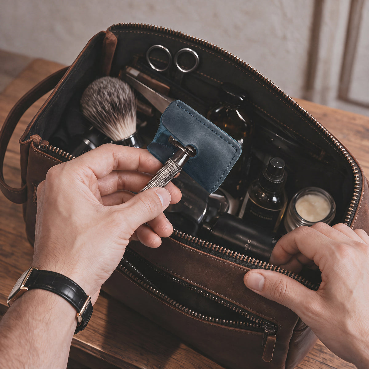Side view of a Razor Head Cover by Hide & Drink fitted over a double edge safety razor, showcasing the protective sheath design in full grain leather. Ideal for safe traveling, this cover reflects handmade quality and small batch production from La Antigua Guatemala and Oaxaca Mexico.