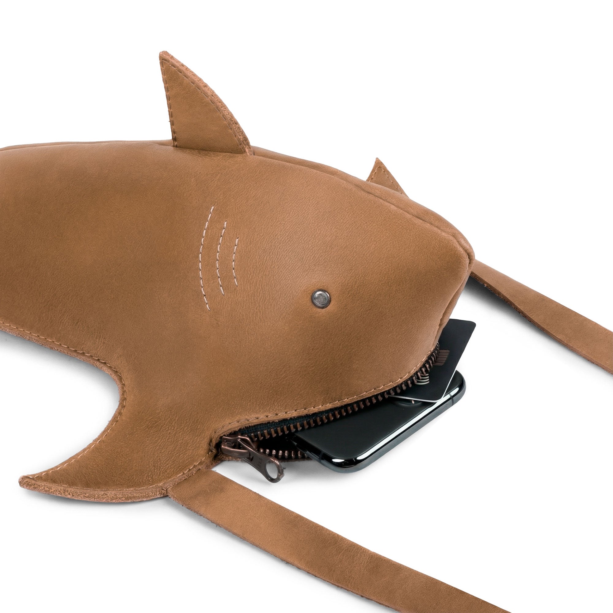 Interior view of the Shark-Shaped Shoulder Bag by Tudi Frudi, demonstrating spacious capacity despite its compact design, made from artisan-quality Full Grain Leather and showcasing hand cut and hand sewn details.