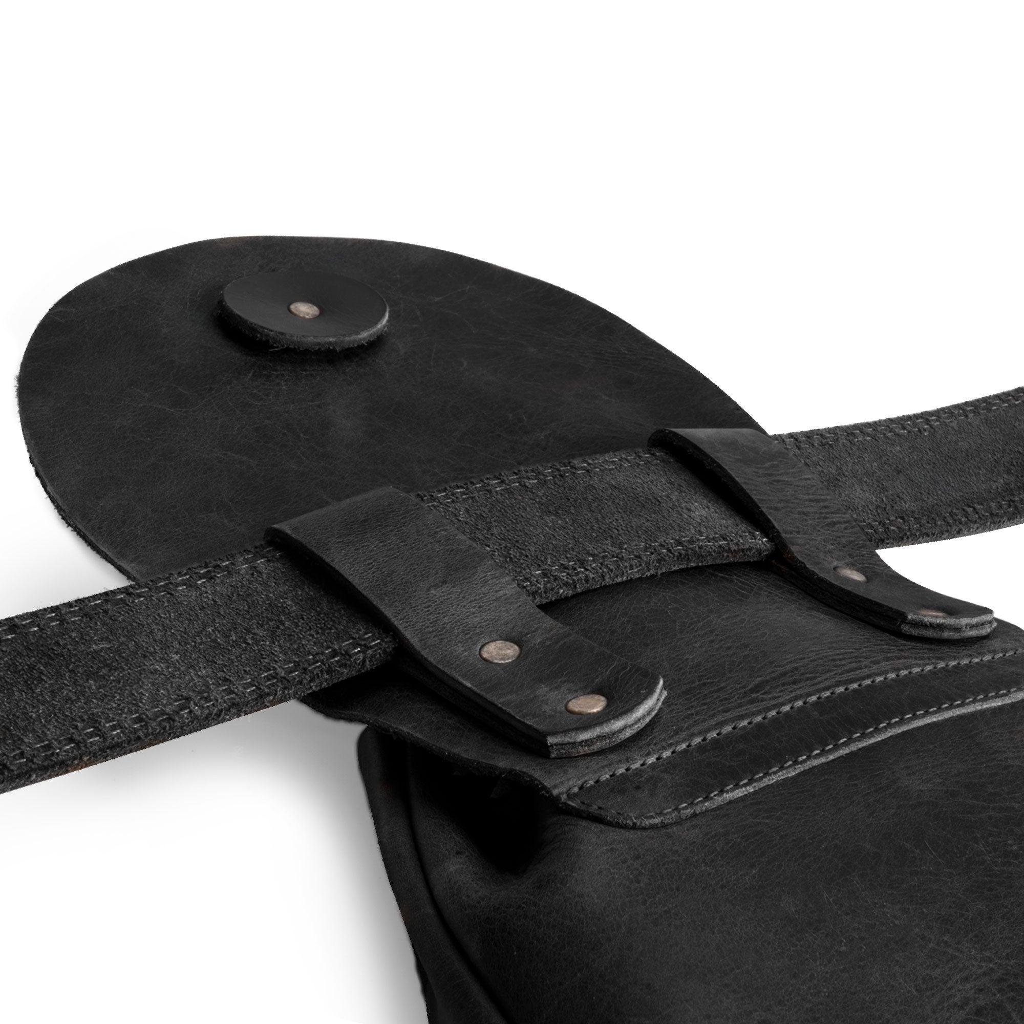 Close-up of the strap and fasteners on the black Valhalla Gear Bushcraft Bag, emphasizing its quality craftsmanship and secure design as a portable safe pouch for valuables.