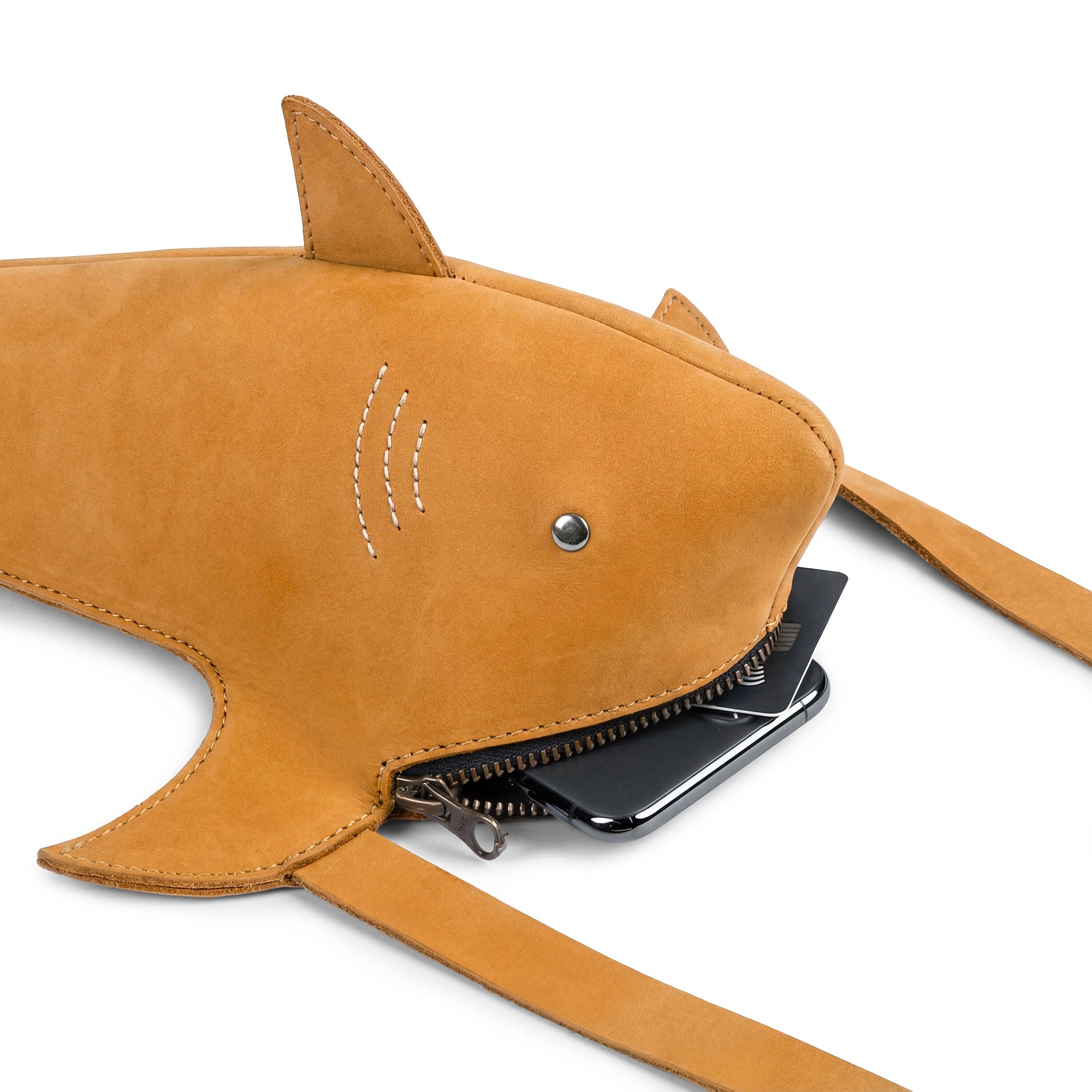 Close-up of the Shark-Shaped Shoulder Bag by Tudi Frudi, revealing its spacious interior and quality craftsmanship. Made from Full Grain Leather and designed for versatility, this handmade crossbody and messenger bag showcases small batch production, hand cutting, and sewing for unique accessories.