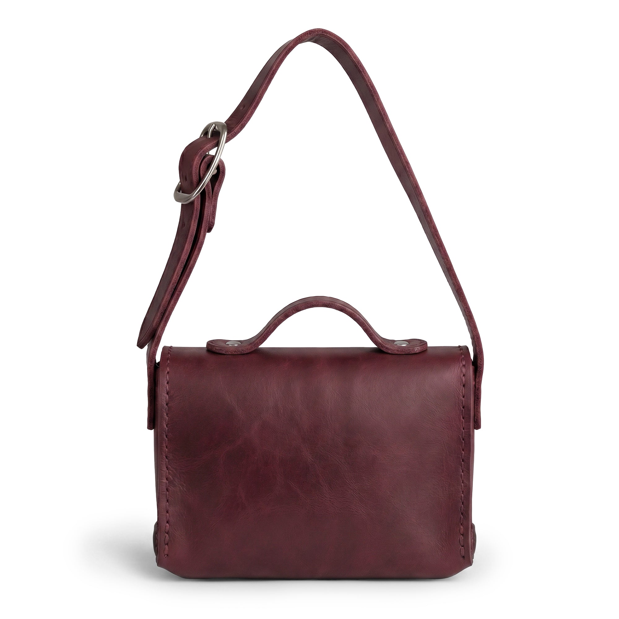 Back of the burgundy Tiny Messenger Bag by Hide & Drink, showcasing its elegant design in Full Grain Leather. This Mini Messenger Bag Charm serves as both a keychain and a fashionable handbag accessory, representing quality artisan work from La Antigua Guatemala.