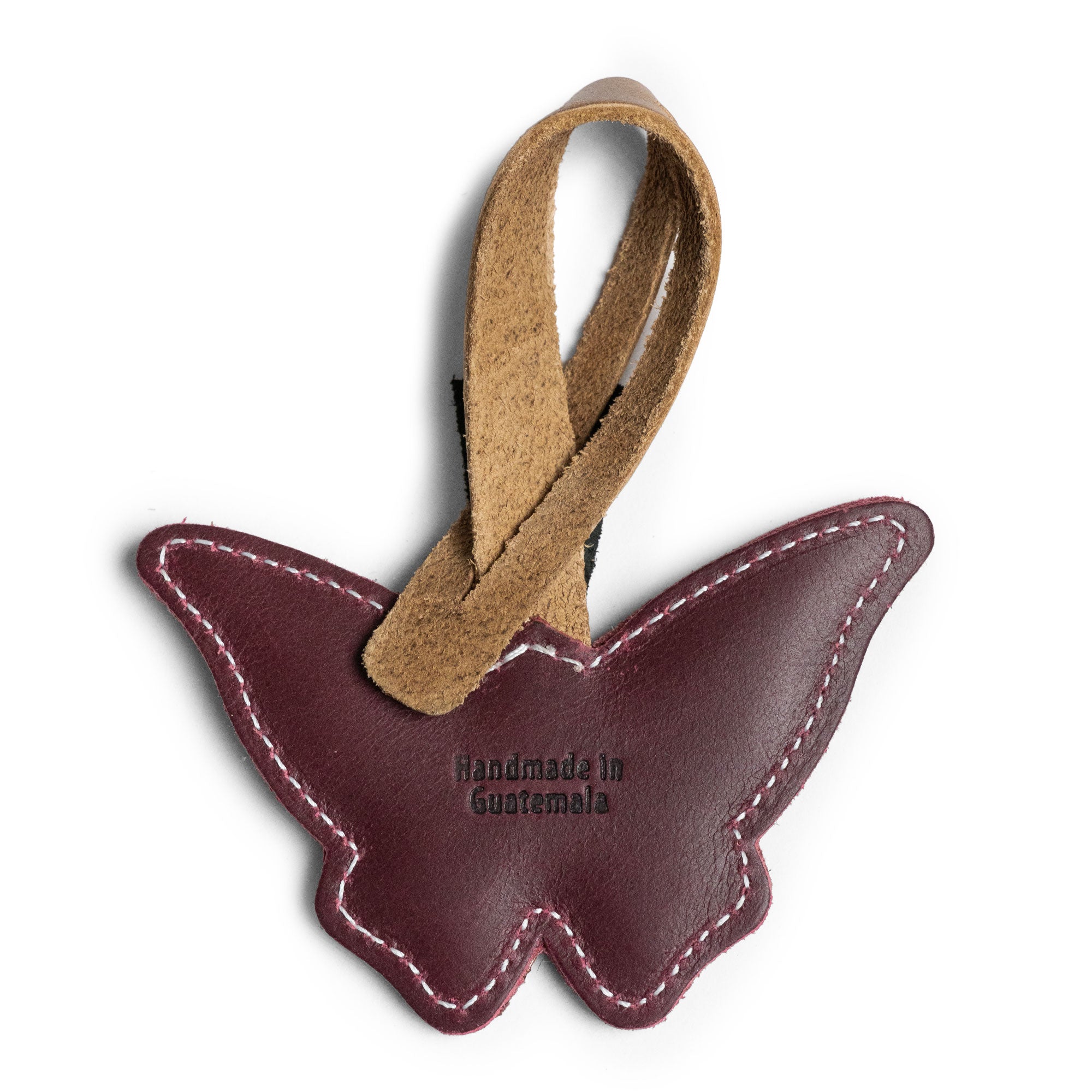 Hide & Drink Bag Charms displaying a unique penguin design, perfect charm for handbags. This purse charm for tote & backpacks crafted from premium full grain leather signifies StockyardX's focus on small batch production. Each piece features hand cut, hand sewn craftsmanship and fire branding, handmade in La Antigua Guatemala & Oaxaca Mexico.