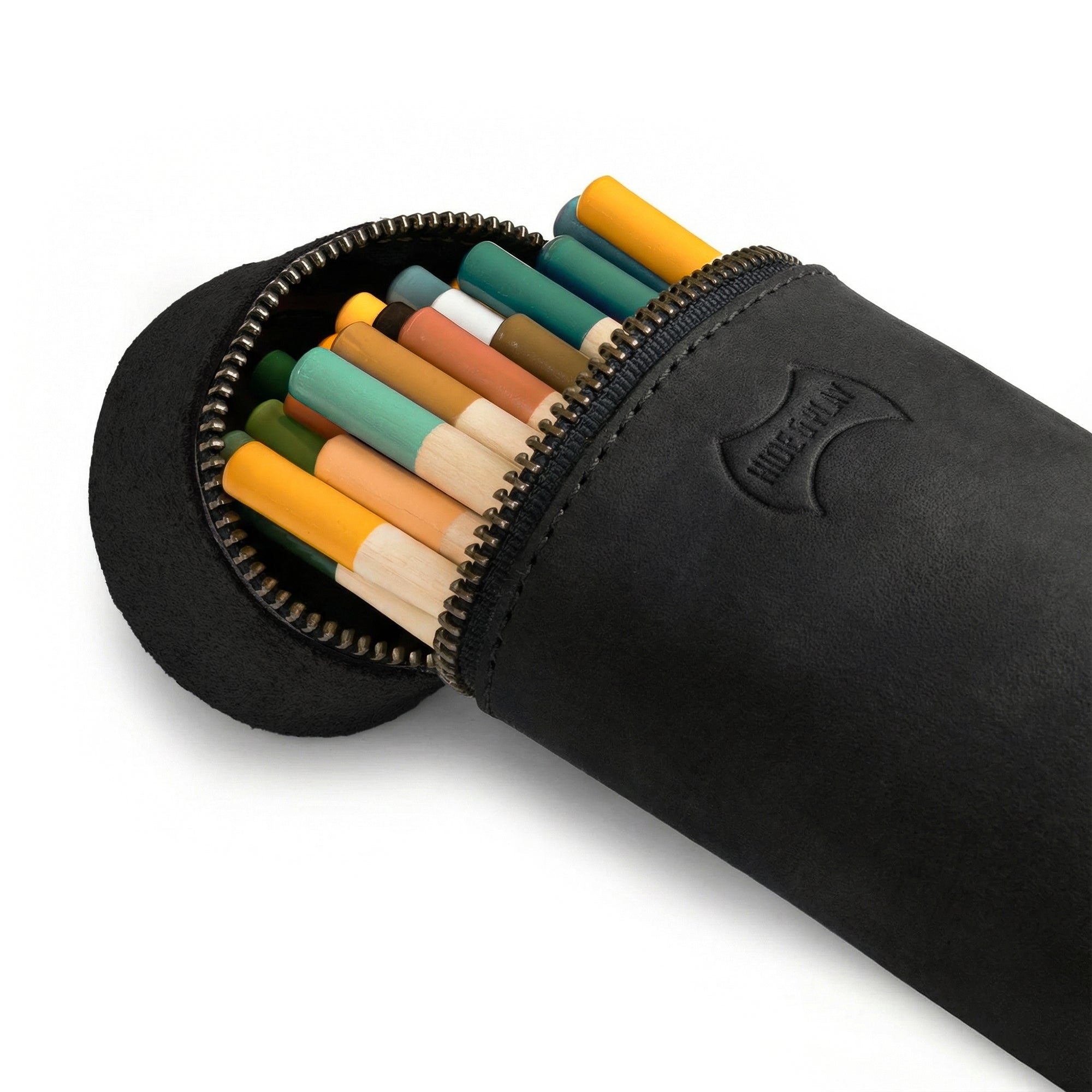Close-up of the zipper of the Pencil-Shaped Case by Hide & Play, filled with colorful writing tools. This artisan-crafted zippered bag is perfect for pens, pencils, markers, and office accessories, emphasizing handmade quality from La Antigua Guatemala.