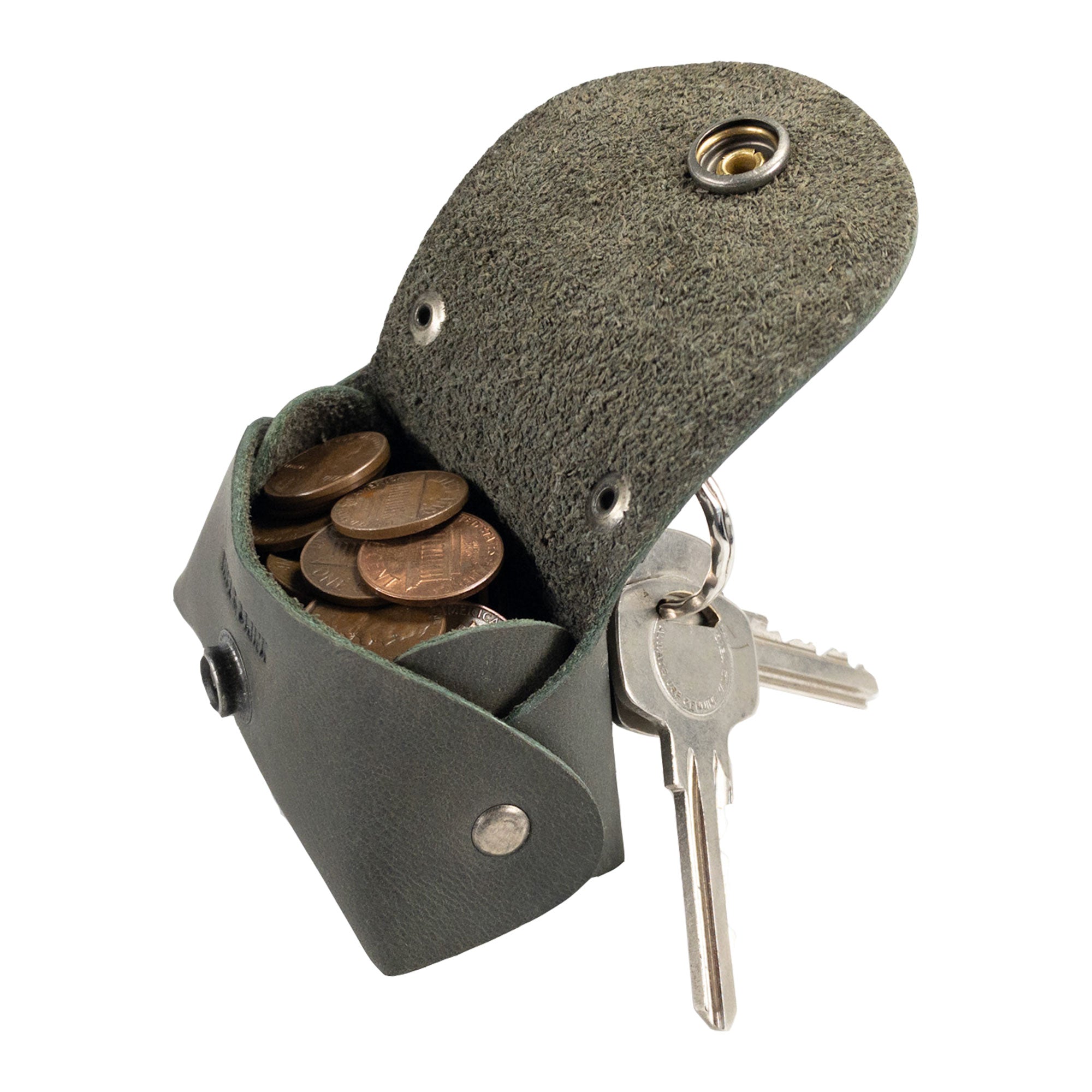 Open view of the Tiny Handbag Keychain by Hide & Drink, displaying a Tiny Handbag with Key Ring Holder crafted from Full Grain Leather. This hand-crafted piece is a testament to Small Batch Production, being Hand Cut, Hand Sewn, and Fire Branded, reflecting the craftsmanship of being Handmade in La Antigua Guatemala & Oaxaca Mexico.