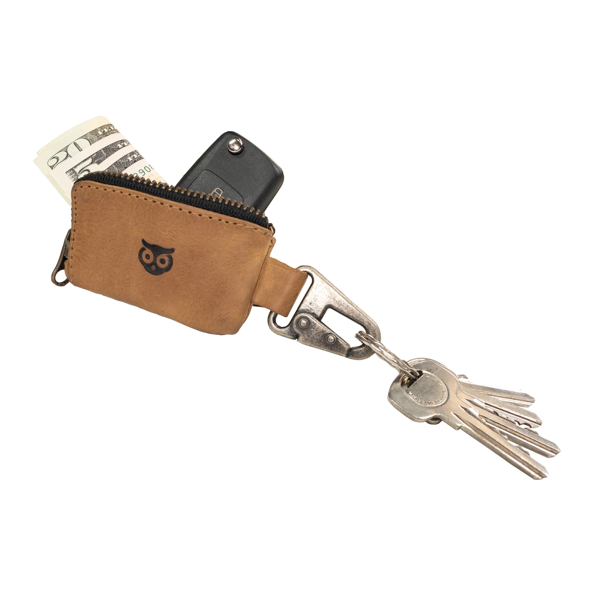 Detailed view of the Car Key Holder by Hide & Drink, demonstrating its functional design for holding keys and cash, along with storage for Headphone and charging Cables, Memory Cards, and Flash Drives. Crafted from durable Full Grain Leather with a Nickel Metal Clasp, highlighting artisan quality from Small Batch Production in La Antigua Guatemala & Oaxaca Mexico.