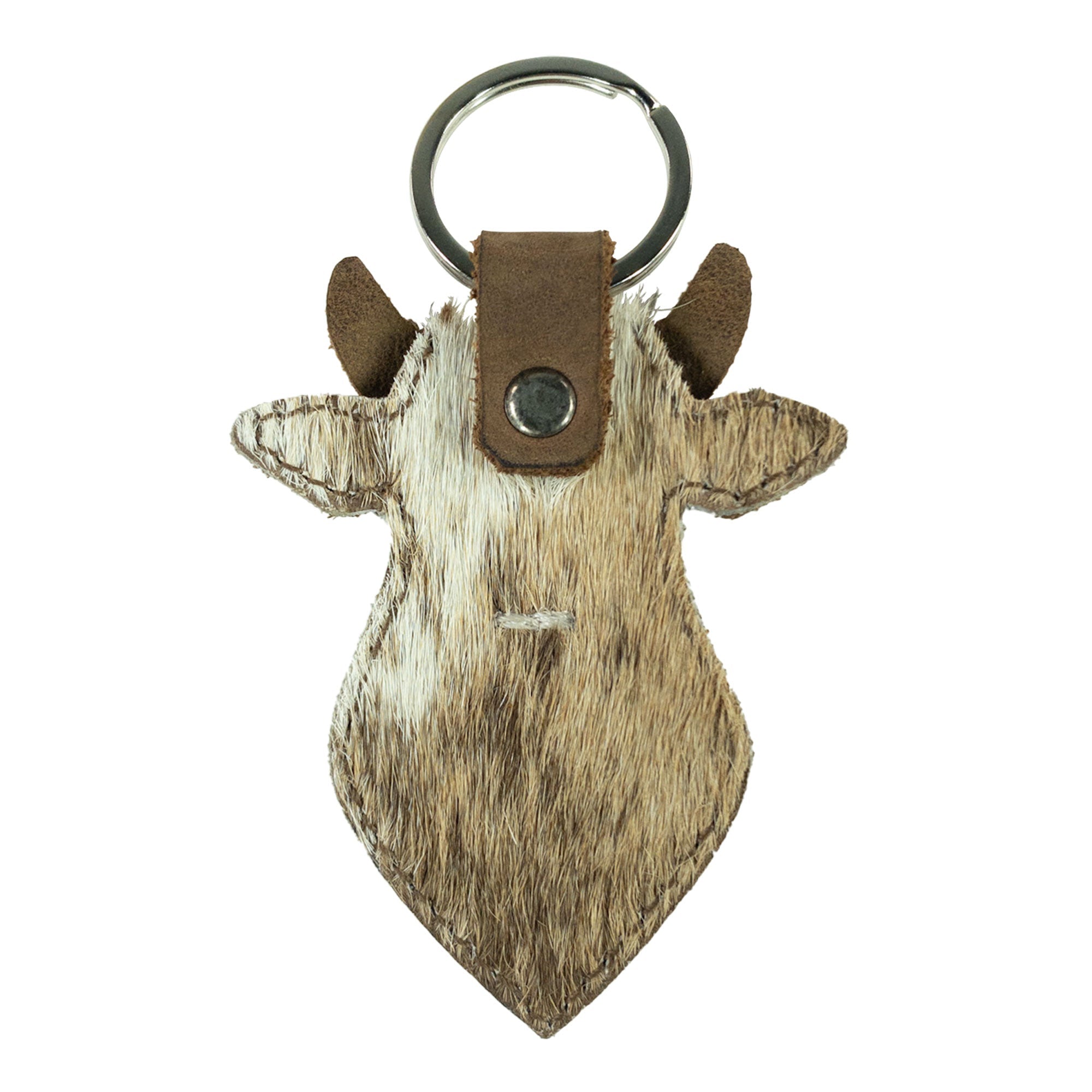 The side view reveals the intricate details of the Cow Head Keychain by Western Leather Works. This handcrafted keyring, made from full grain leather, showcases a lovely cowboy aesthetic. Perfect for anyone looking for a functional yet stylish key organizer, this piece highlights small batch production from La Antigua Guatemala.