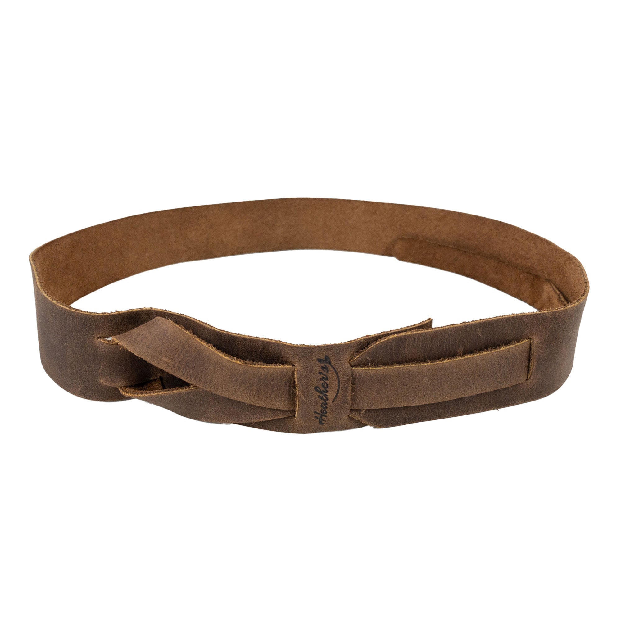 Close-up of Heather's Fashion Belt for Women displaying its elegant buckle-free design. This full grain leather belt is a versatile waist strap accessory available in rich colors, handmade in La Antigua Guatemala. Fashion Belt for Women without Buckle, No-Buckle Belt, Stylish Belly Accessory, Small Batch Production, Hand Cut, Hand Sewn, Fire Branded, Artisan.