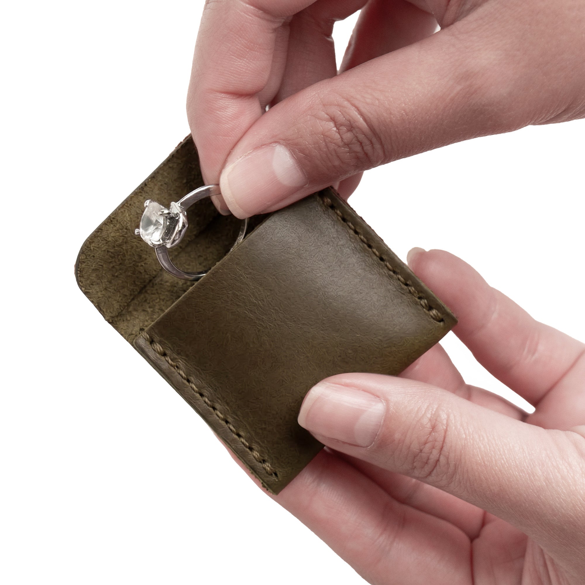 Showcasing Hide & Drink Wedding Ring Case featuring an engagement ring, designed for elegance and practicality. Ideal as a small bearer or pouch organizer for travel, crafted from full grain leather in La Antigua Guatemala & Oaxaca Mexico.