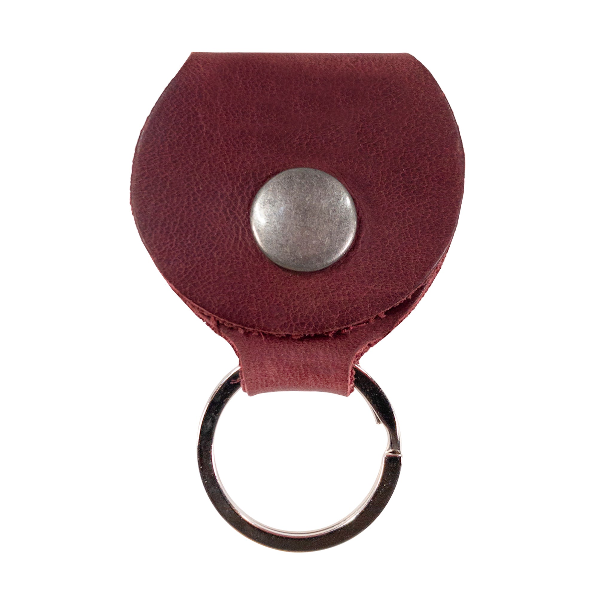 Front view of the Key Chain & Guitar Pick Holder by Hide & Drink showing its simple functionality and a button closure. This Guitar Pick Holder with Ring is ideal for organizing keys and picks for guitar players. Crafted from high-quality Full Grain Leather, it reflects small batch production values with Hand Cut and Hand Sewn craftsmanship, featuring a fire branded design, handmade in La Antigua Guatemala & Oaxaca Mexico.